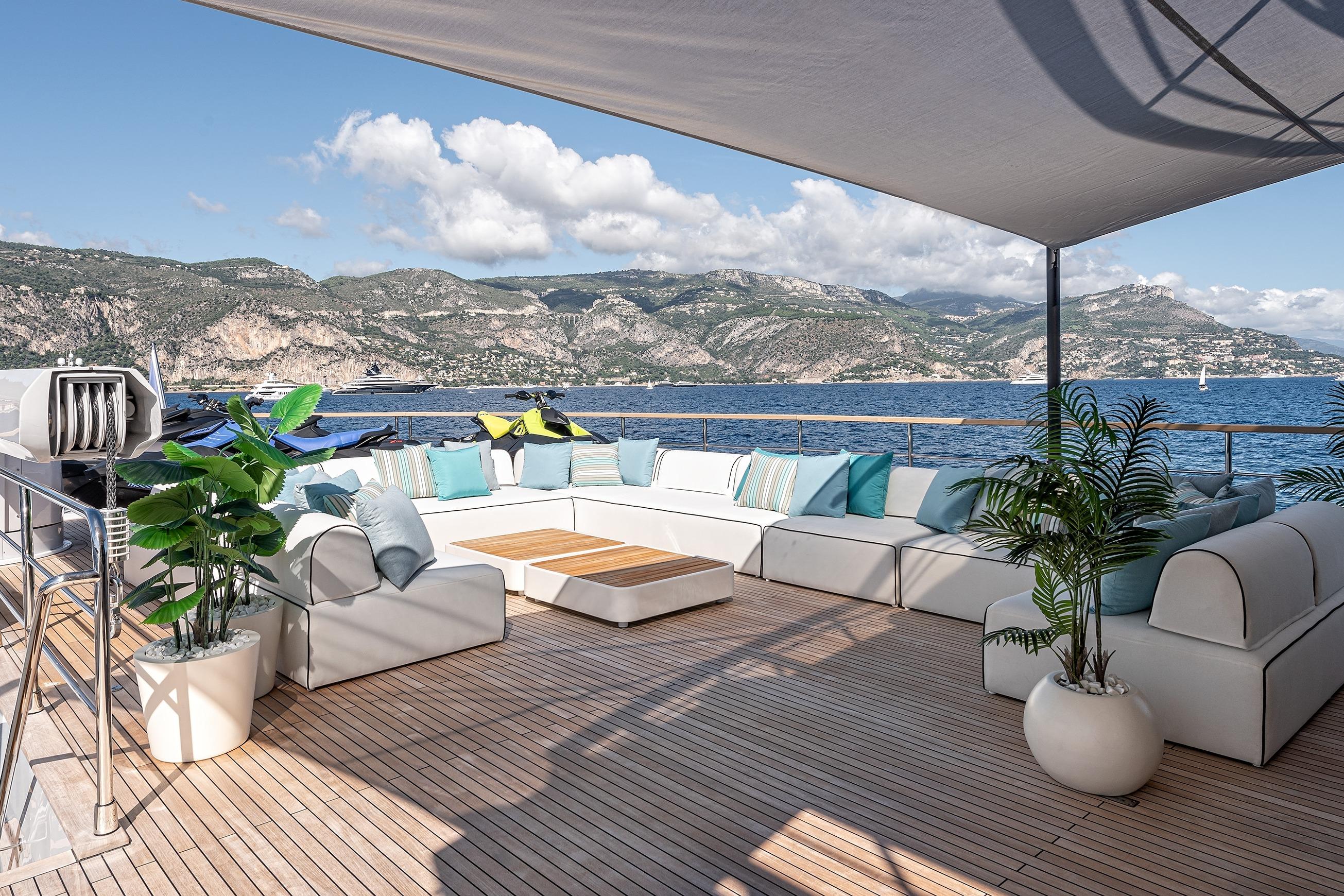 Luxurious 2025 Numarine 37XP yacht deck with elegant seating and scenic ocean view.