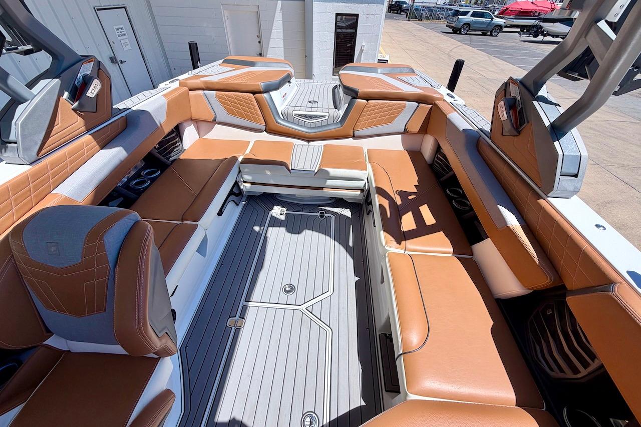 2021 Nautique Super Air Nautique G23 interior with luxurious tan and gray seating.