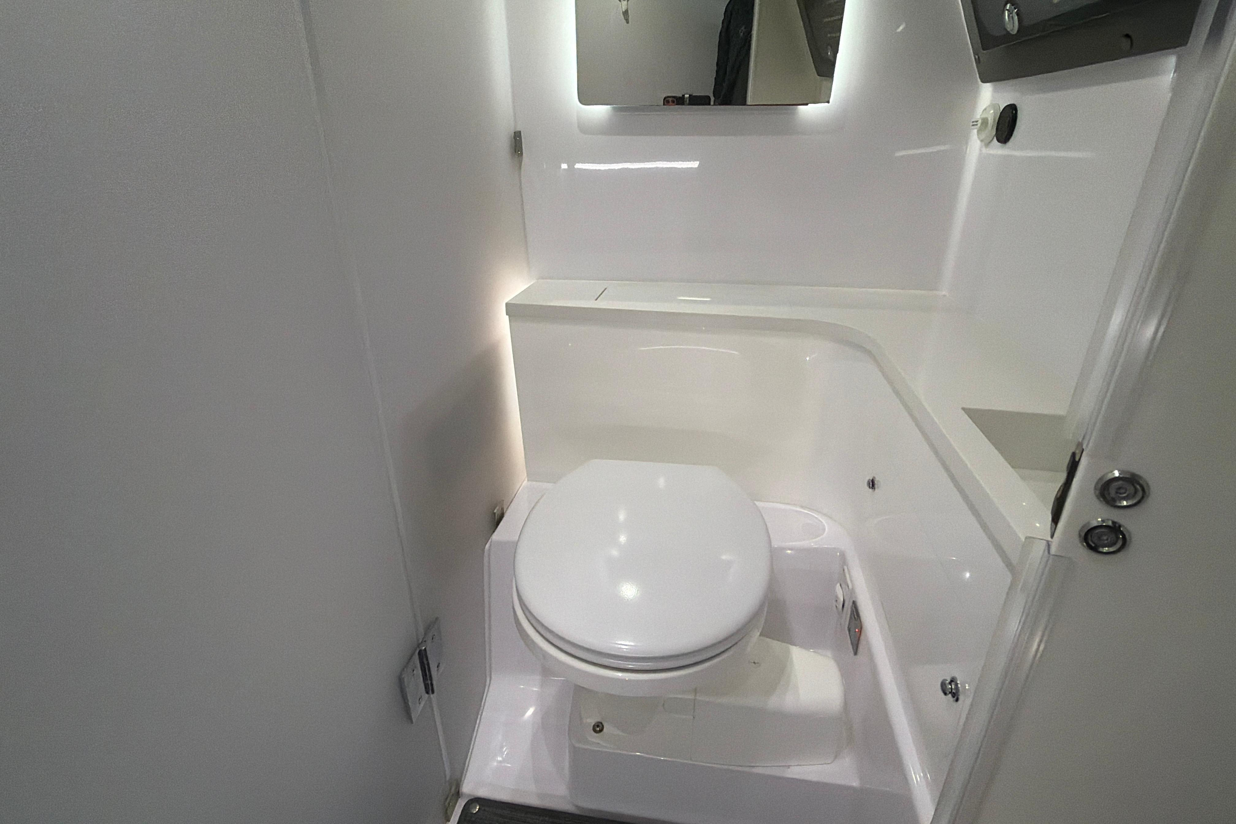 2022 Axopar Brabus 37 XC Cross Cabin bathroom with modern white fixtures.