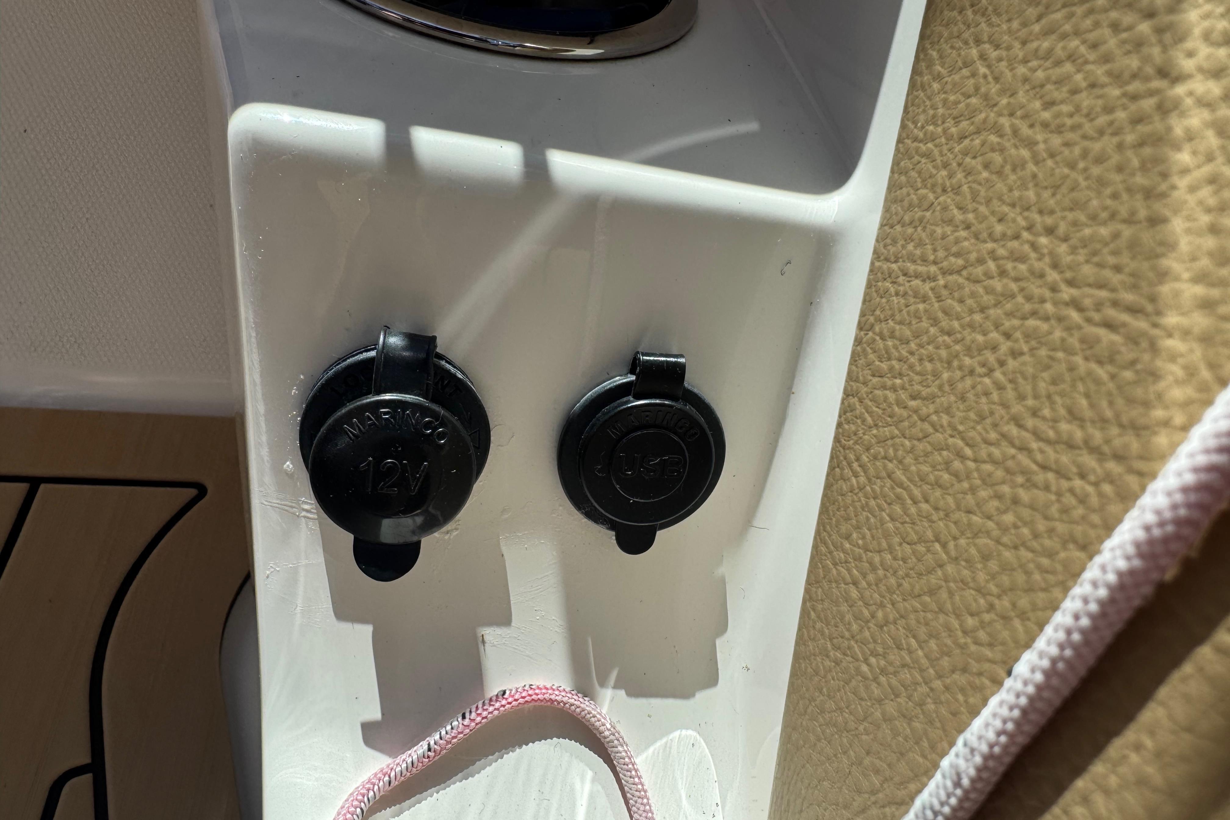 12V and USB ports on a 2021 Sea Ray SPX 190 boat dashboard.