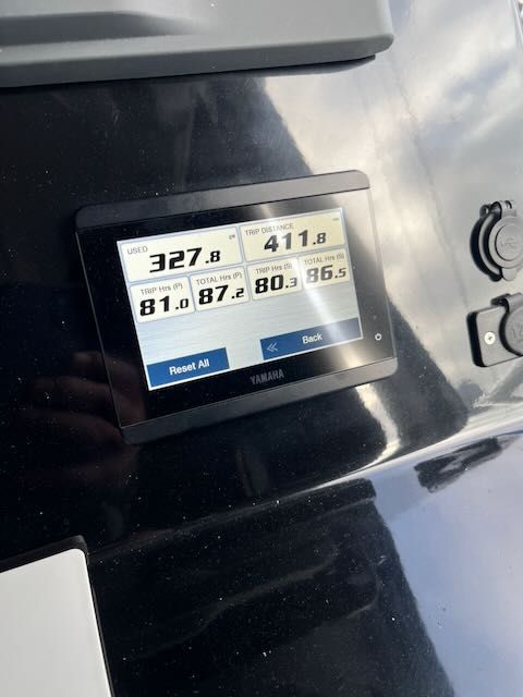 A Yamaha screen displays boat data such as speed and distance.