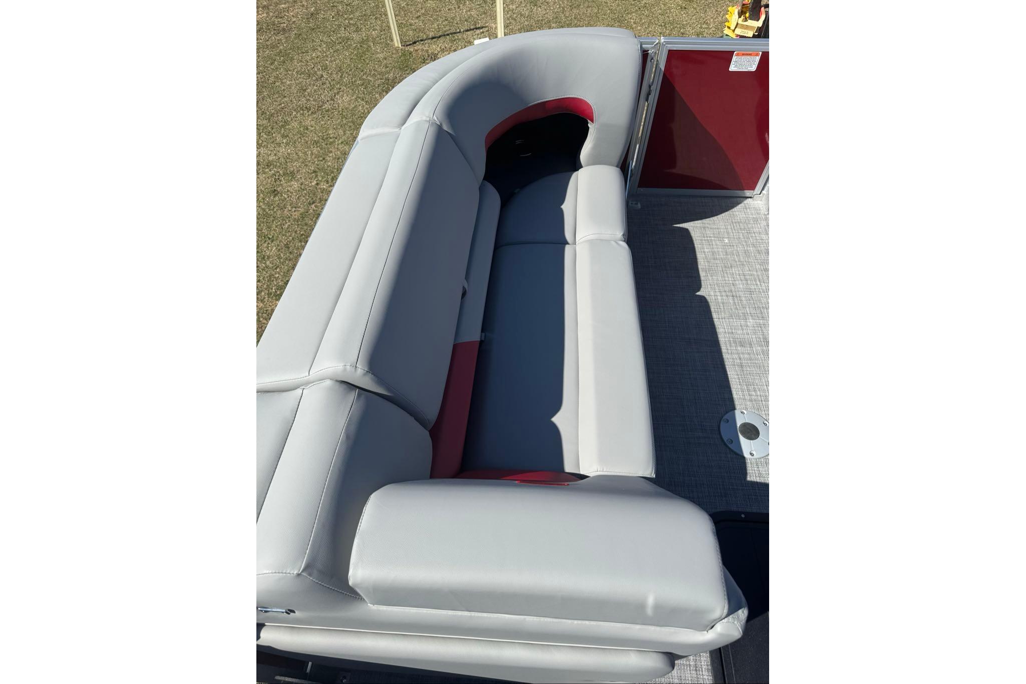 2026 Sun Tracker Party Barge 22 XP3 pontoon boat with gray seating and red accents.