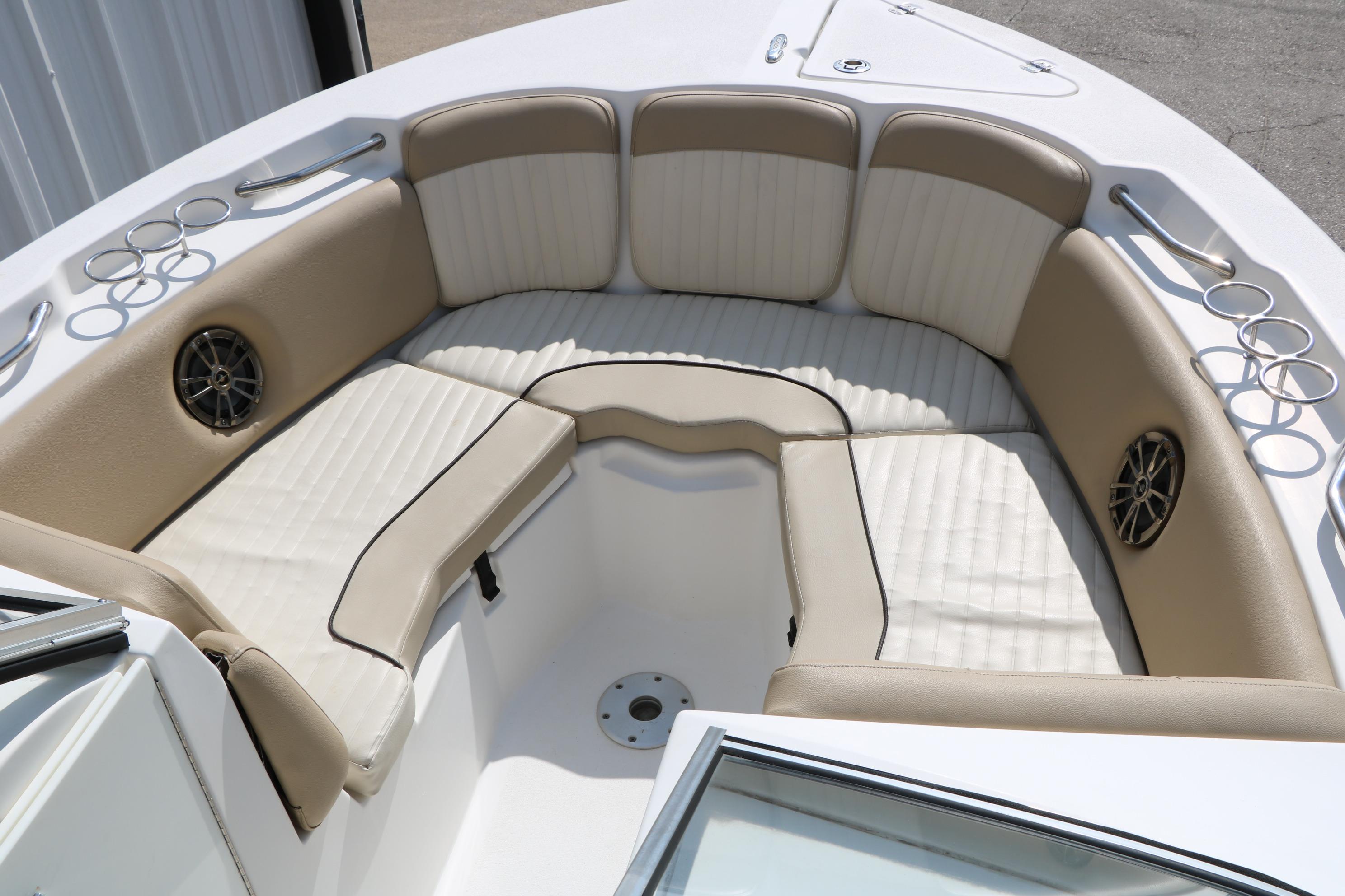 2017 Sea Fox 226 Traveler boat interior with beige seating and cup holders.