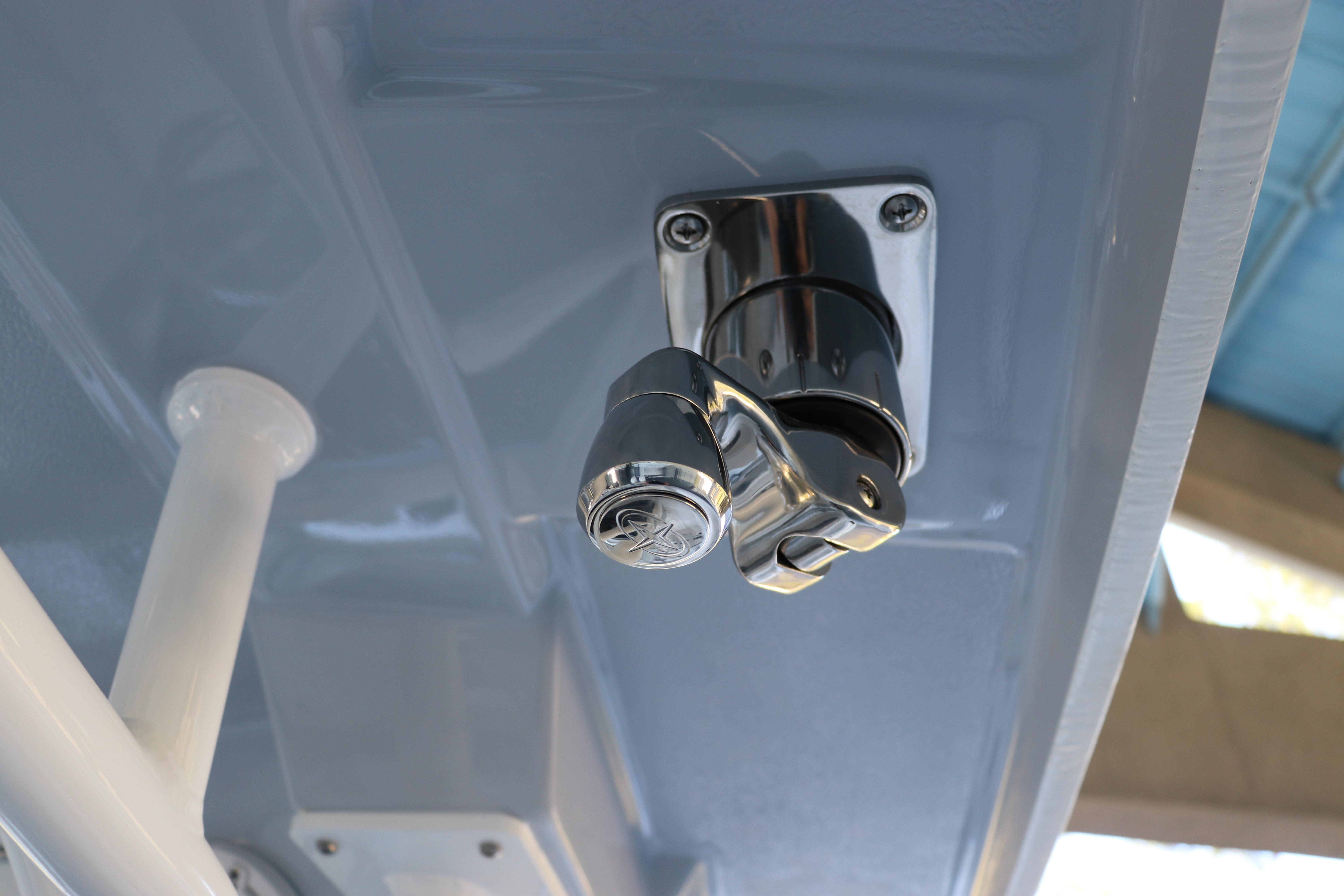 2026 Robalo R250 Center Console boat detail, featuring a chrome fixture on the ceiling.