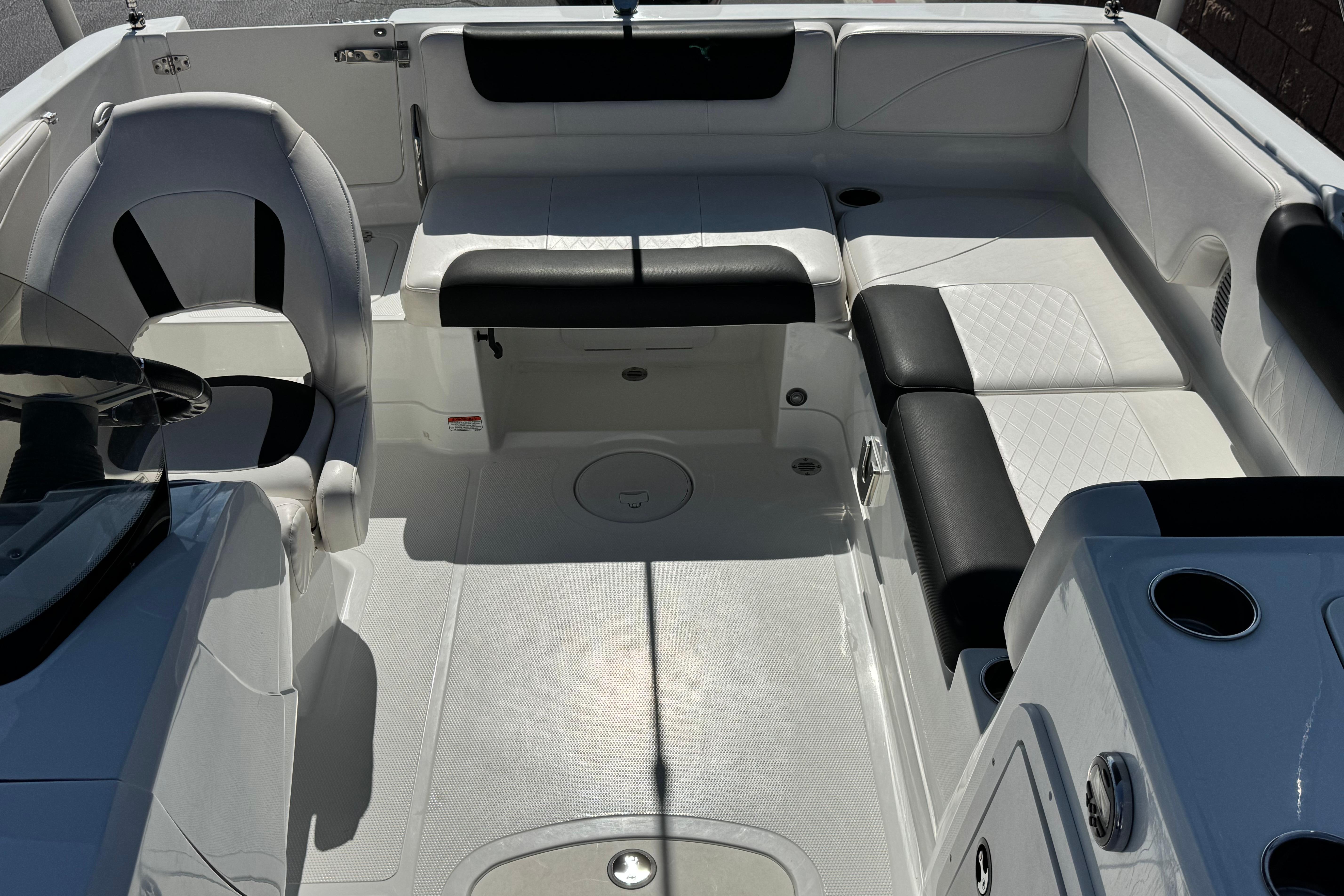 Interior of a 2019 Tahoe 2150 boat with white and black seating.