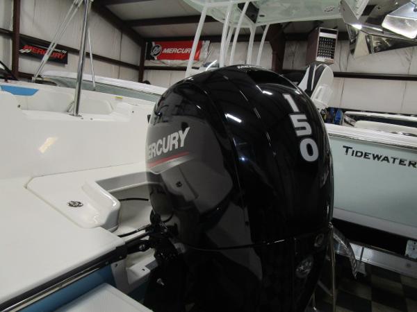 2023 Bayliner 210EL with Mercury 150 outboard engine in showroom.