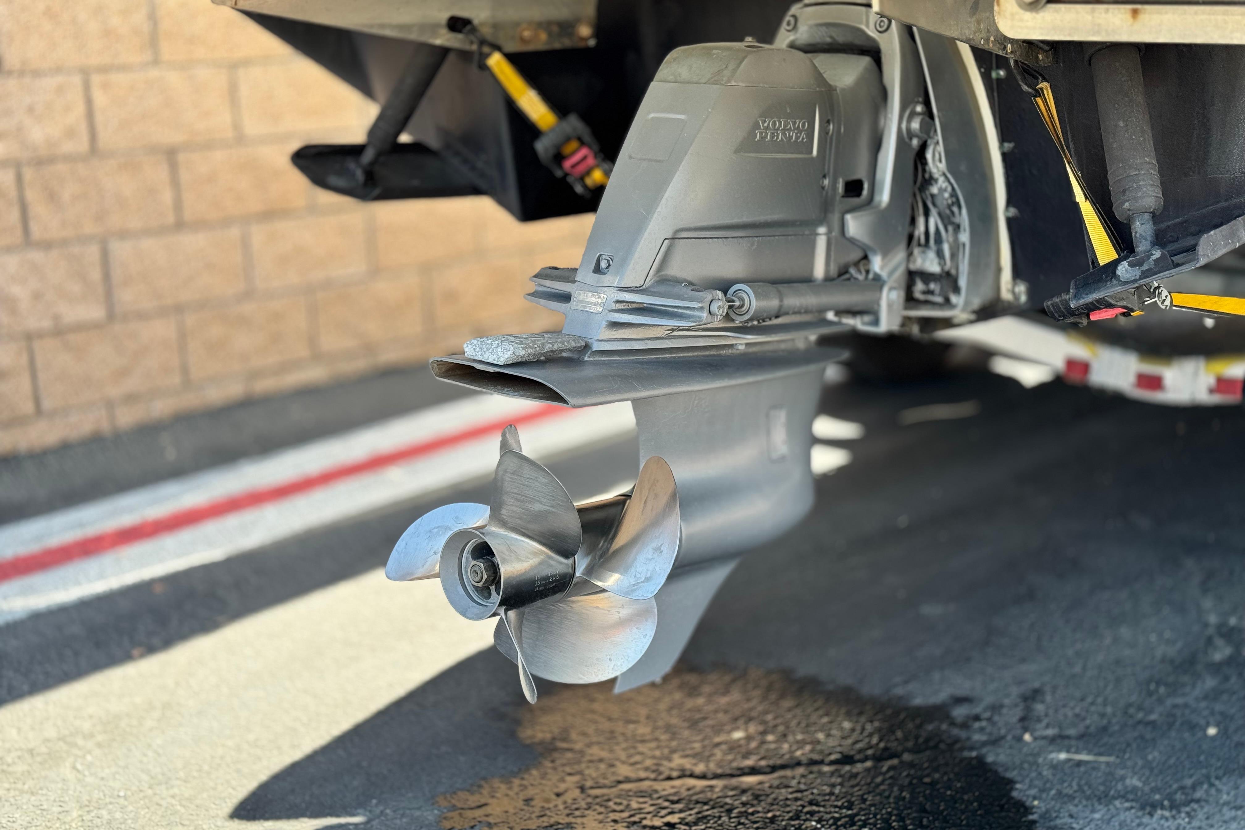 Close-up of a 2008 Cobalt 262 boat propeller and drive system.
