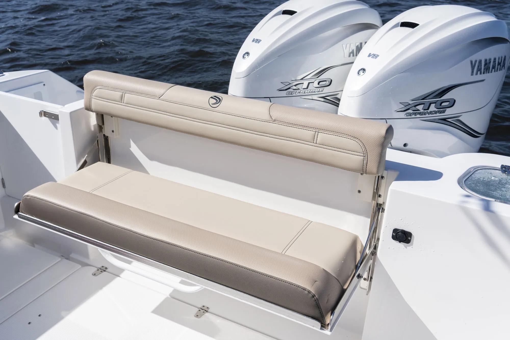 2026 Edgewater 340CC boat with Yamaha XTO engines and beige seating.