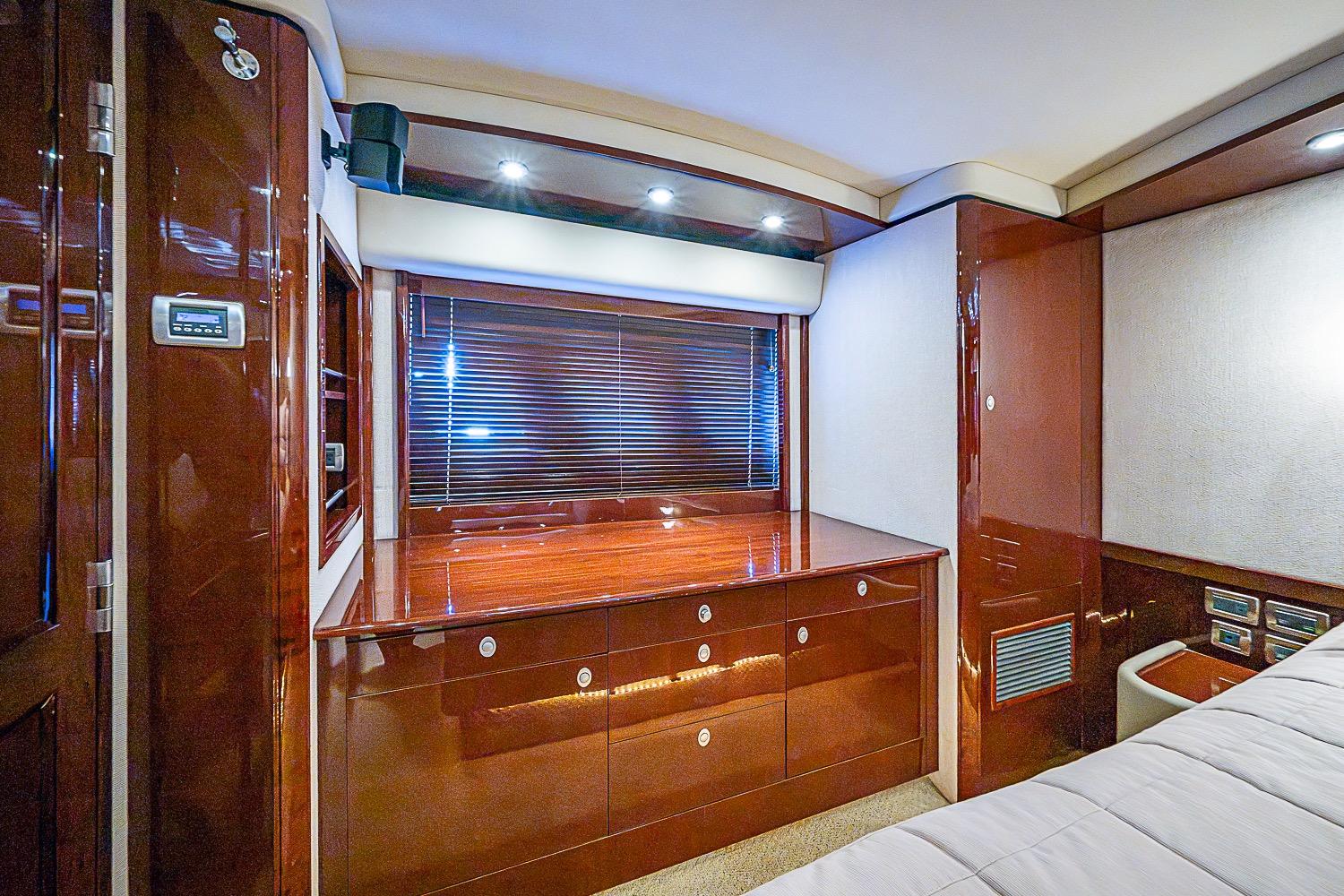 Luxurious interior of 2008 Sea Ray 60 Sundancer yacht with polished wood cabinetry.
