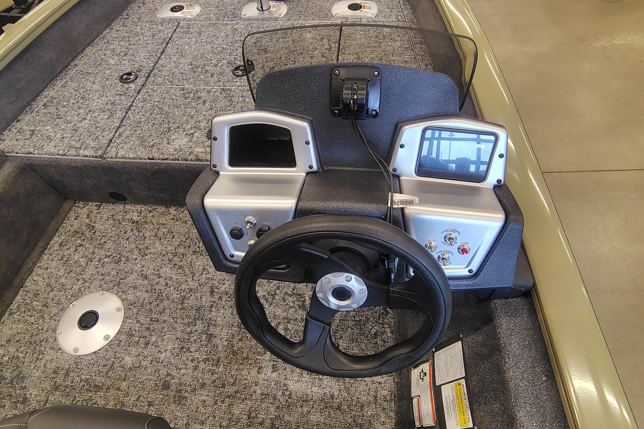 2026 Tracker Pro Team 175 Crappie Edition boat dashboard with steering wheel and controls.