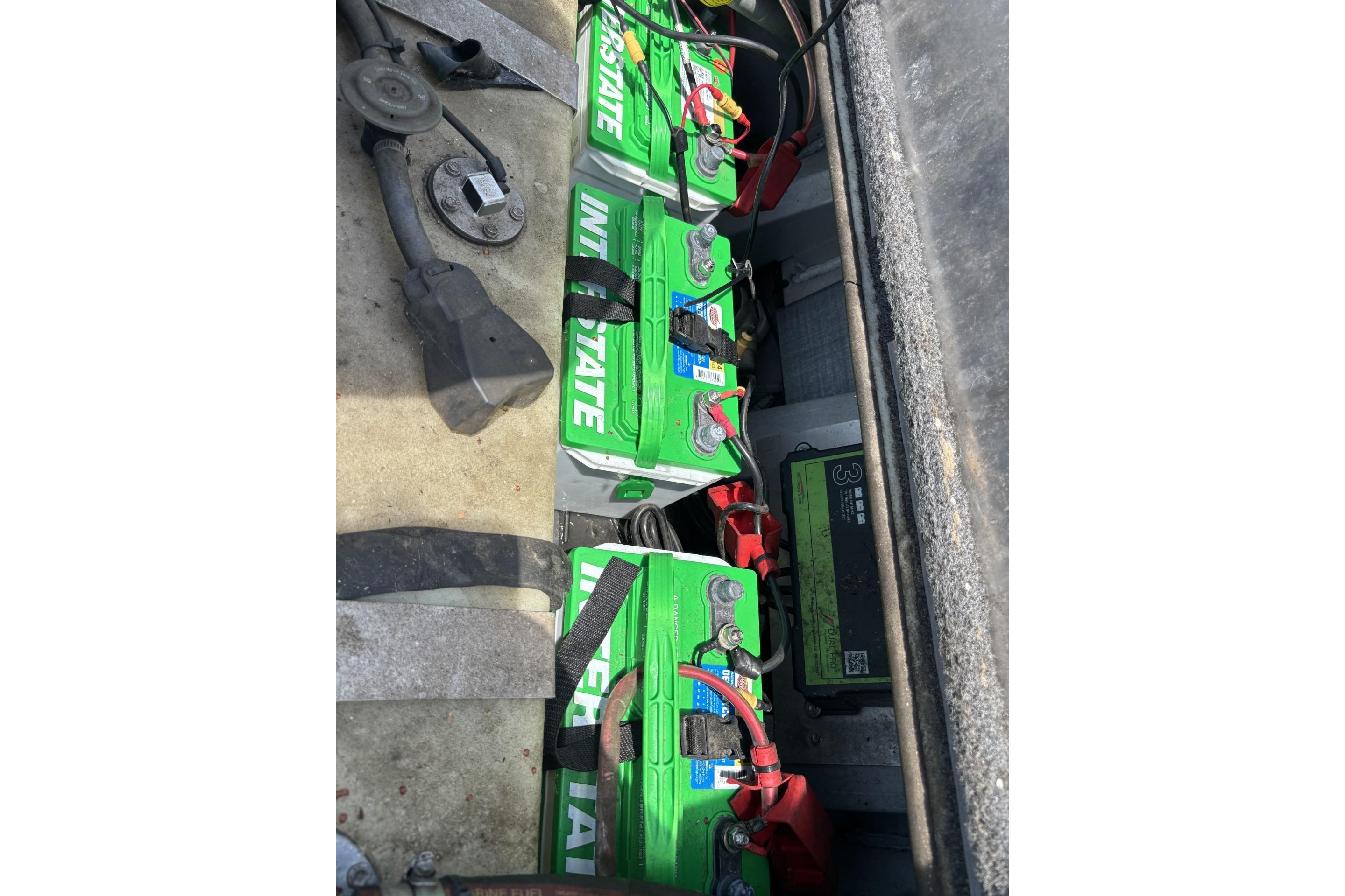 Batteries in a 2017 Ranger RT178C boat, featuring Interstate branding and wiring connections.