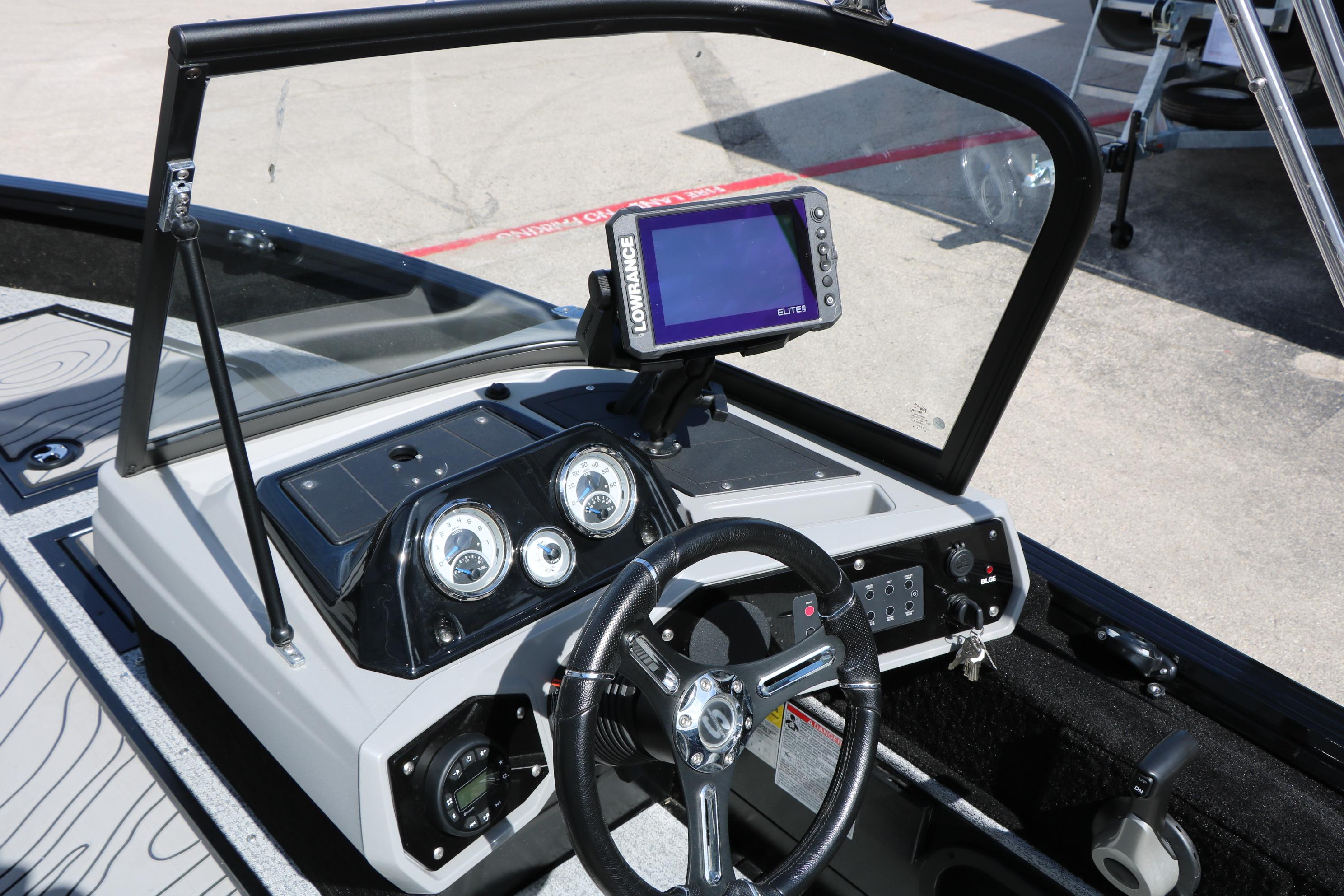 2025 Smoker Craft Adventurer 188 DC dashboard with steering wheel and navigation system.