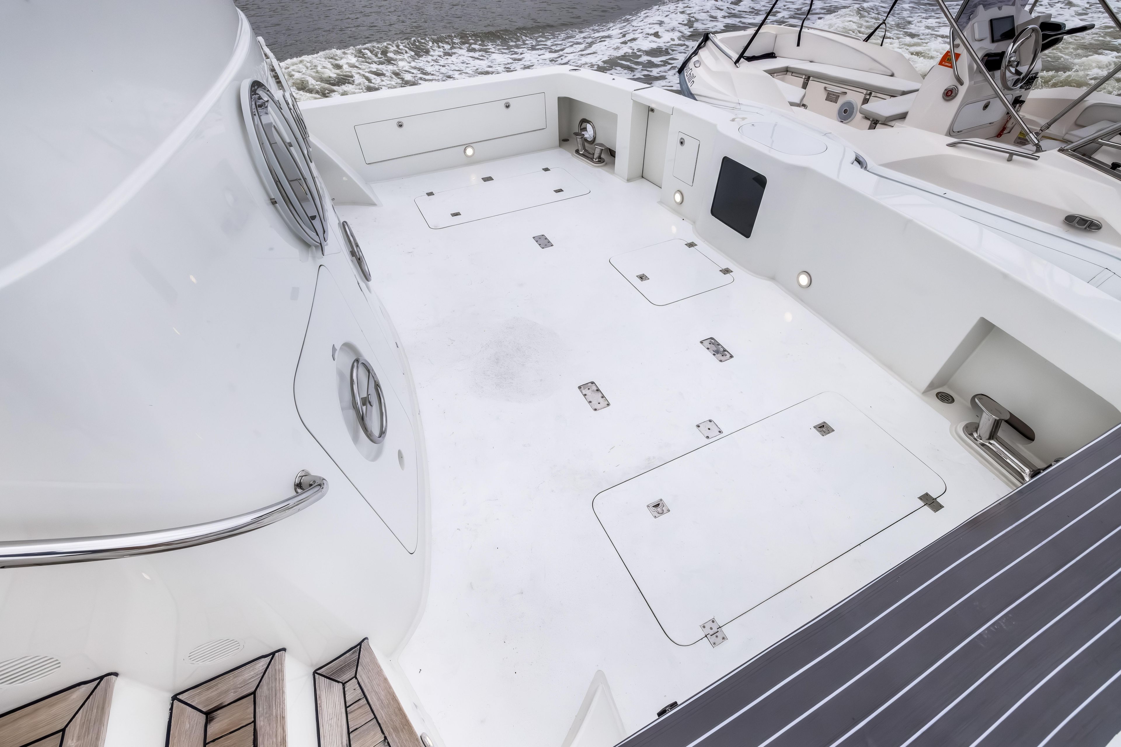 Spacious deck of 2012 Cheoy Lee 84 Bravo yacht, featuring sleek design and modern amenities.