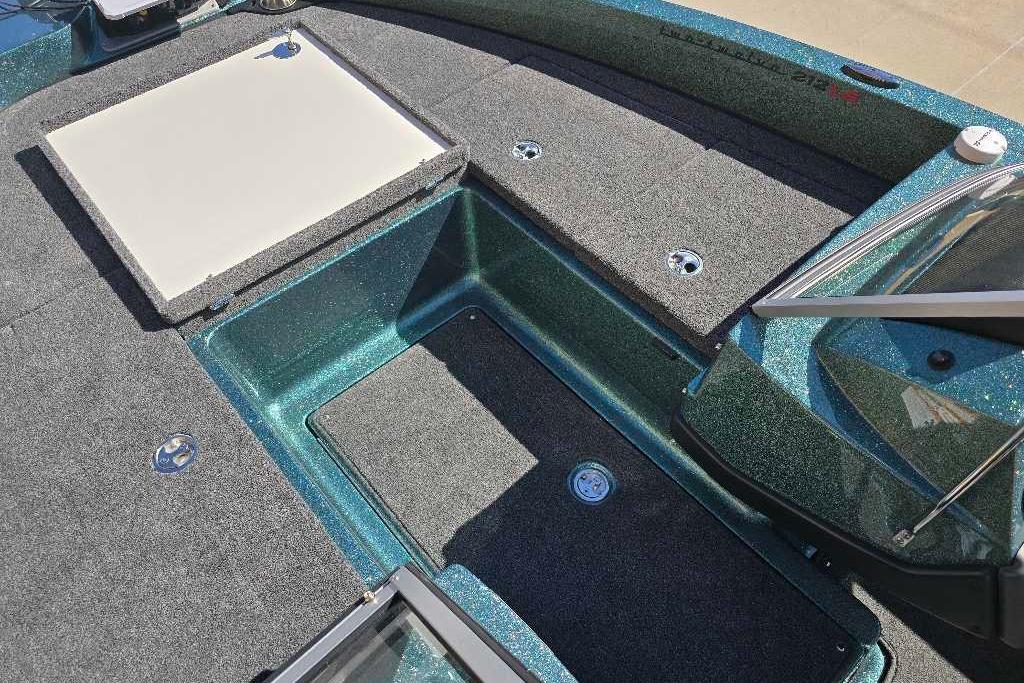 2026 Ranger 212LS boat interior with storage compartments and carpeted deck.