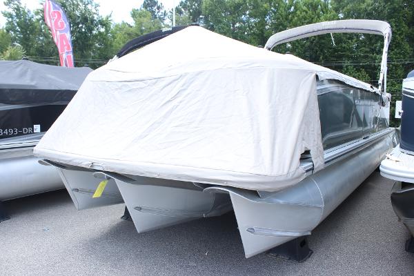 2021 Tahoe LTZ Cruise pontoon boat with cover, parked outdoors.