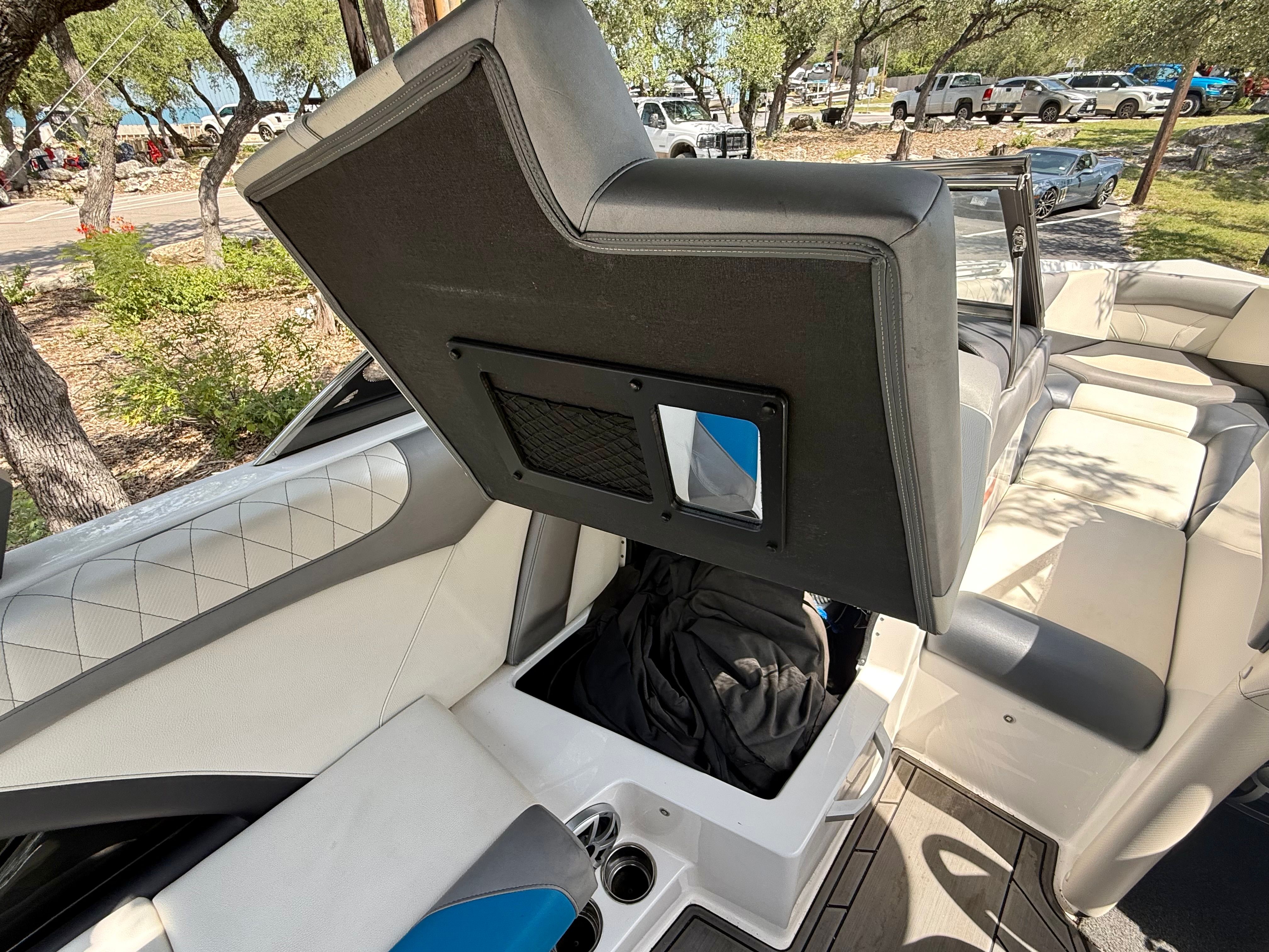 Interior of a 2017 Tigé Z3 with a seat lifted to reveal storage underneath.