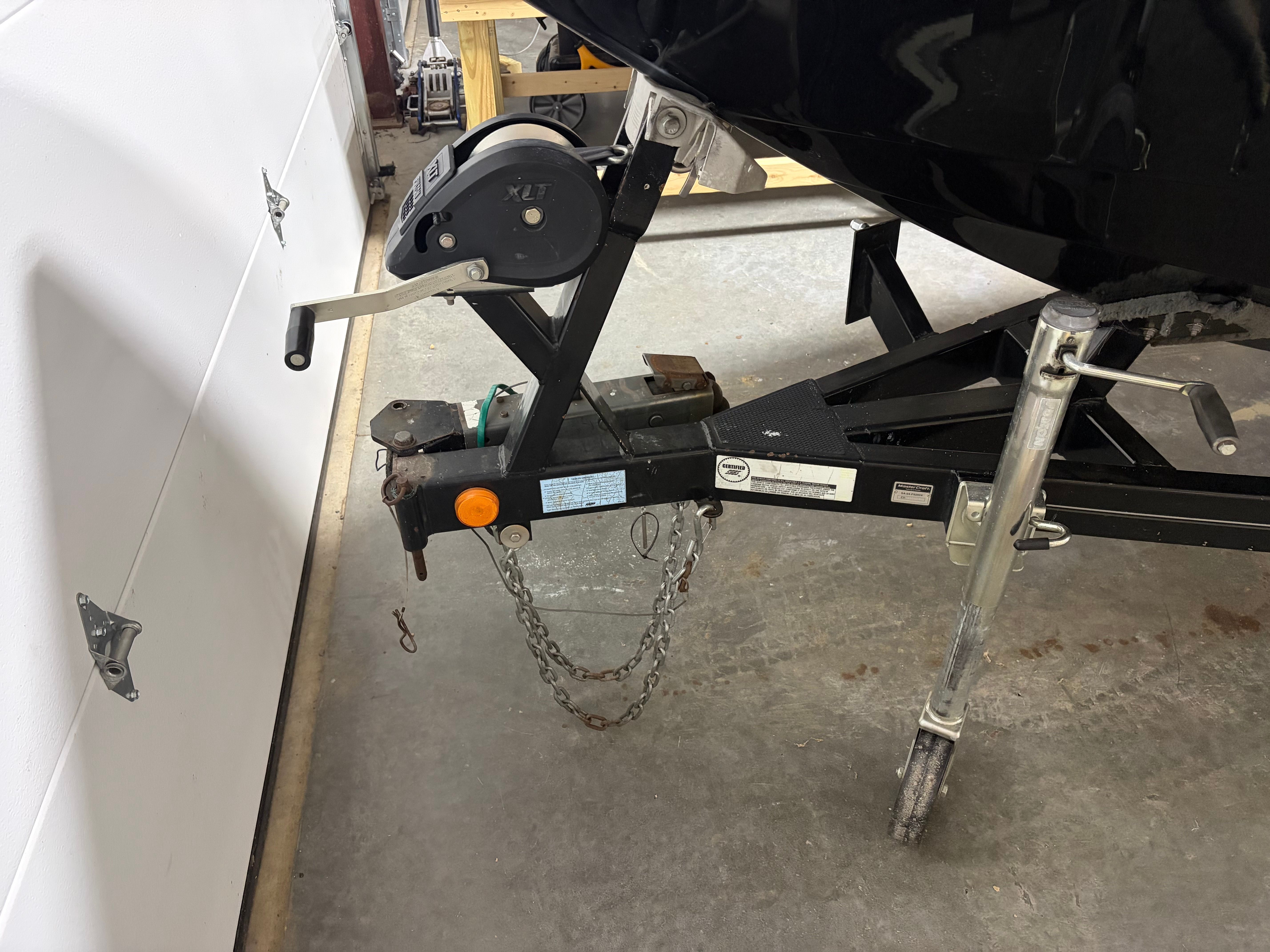 Trailer of a 2004 MasterCraft X2 boat in a garage.