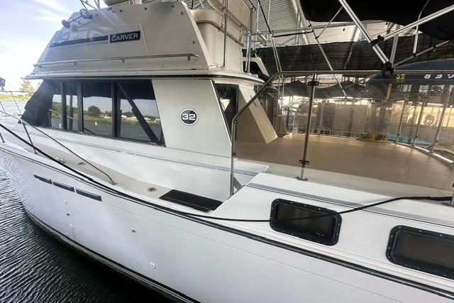 1989 Carver 32 Aft Cabin Motor Yacht docked in a marina.