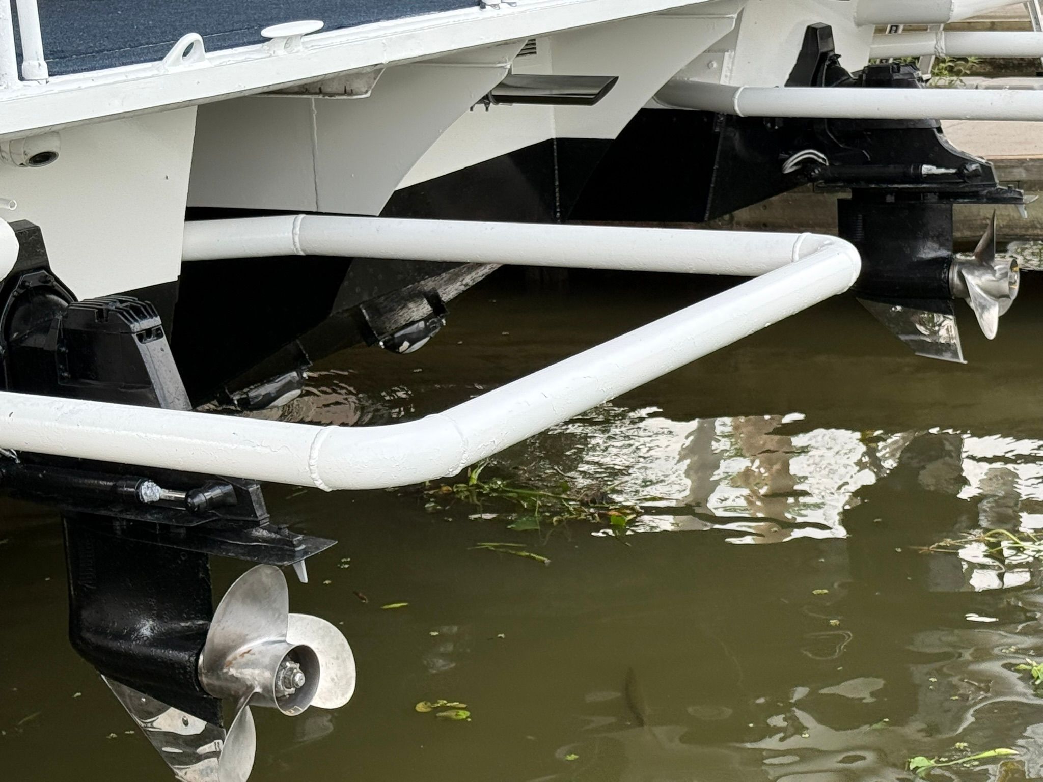 Close-up of a boat's propellers in the water.