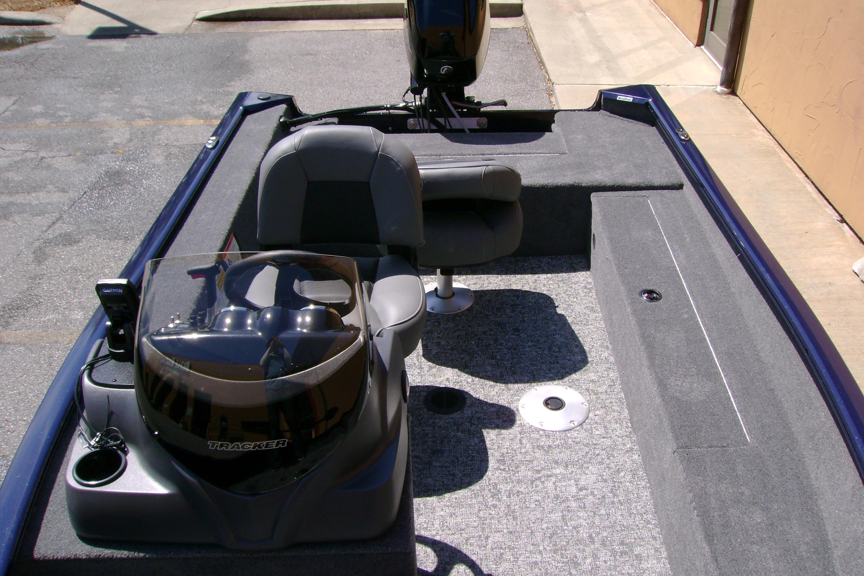2026 Tracker Super Guide V-16 SC boat interior with seating and steering console.