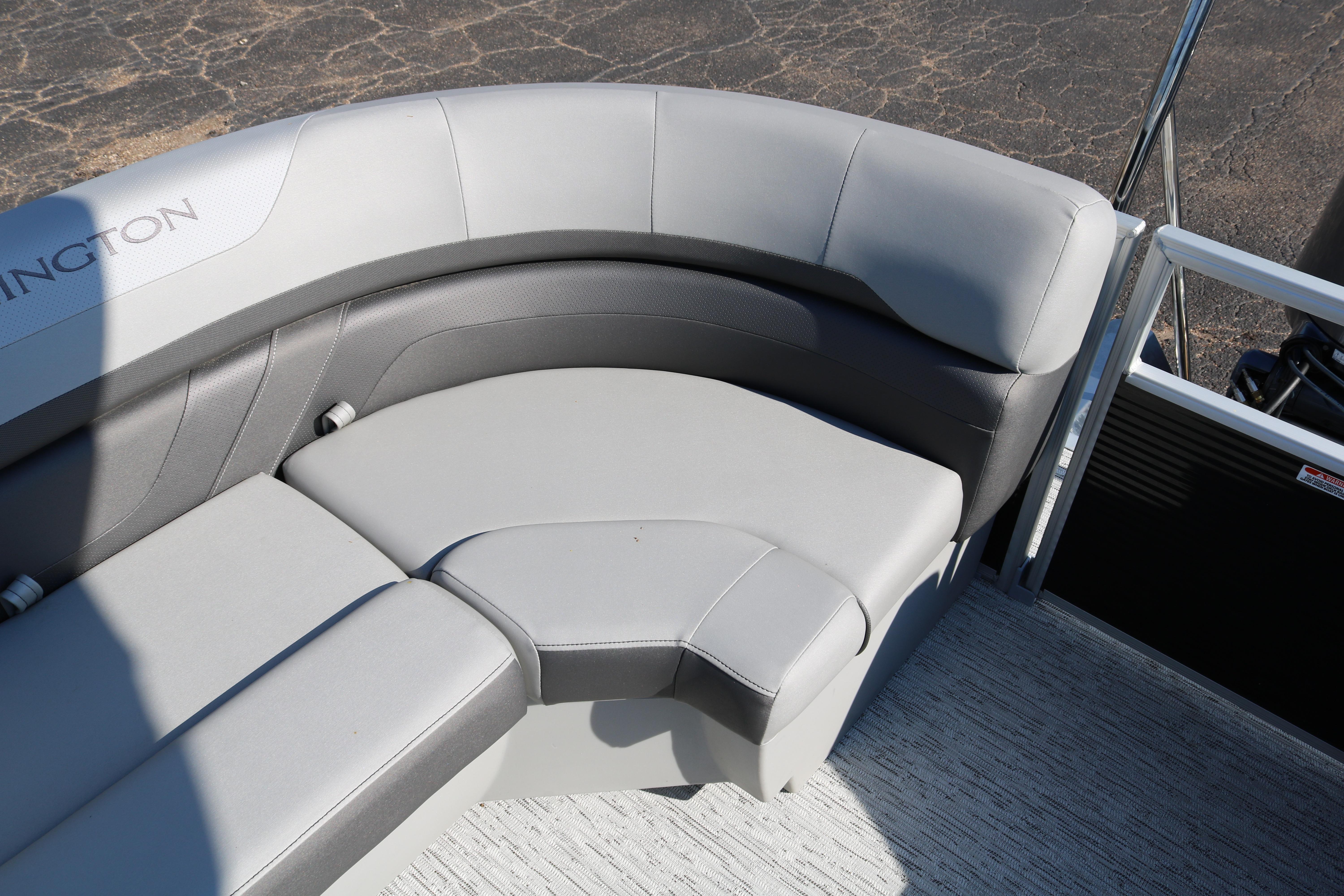 2026 Bennington 22SX Stern Radius boat with sleek gray seating and modern design.