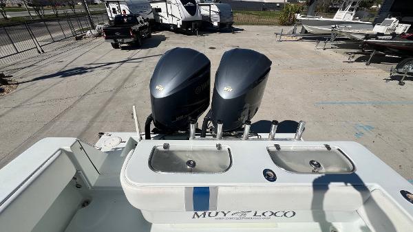 2005 Contender 36 Open boat with dual outboard engines in a marina.