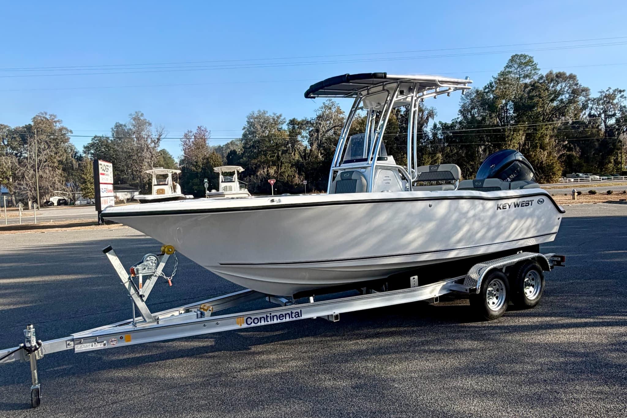 2026 Key West 203 FS boat on a trailer in a parking lot.