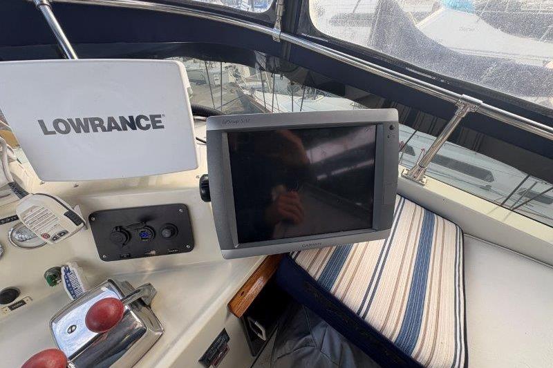 Control panel of 1987 Tollycraft 34 Sundeck Motor Yacht with Lowrance electronics.