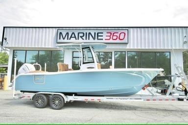 2026 Sea Hunt Ultra 255 SE boat on trailer at Marine 360 dealership.