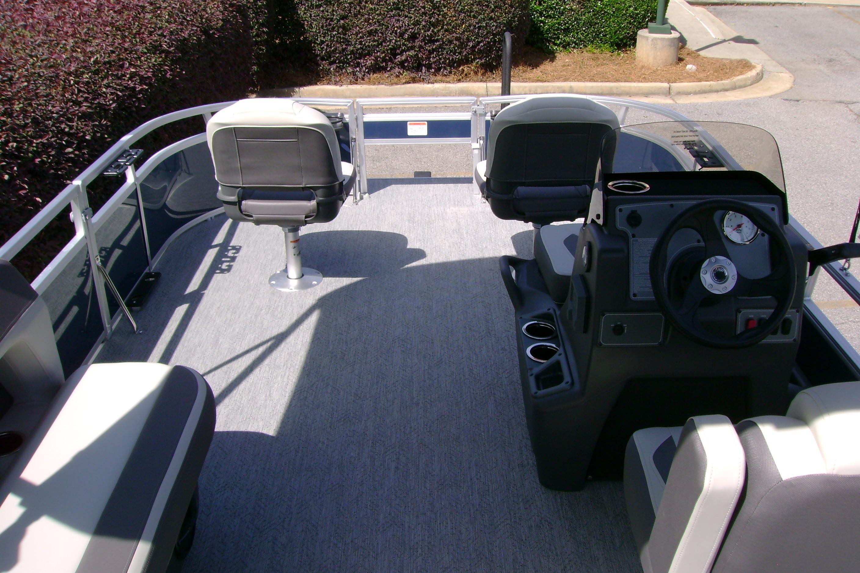 2026 Sun Tracker Bass Buggy 16 XL Select pontoon boat interior with seating and steering console.