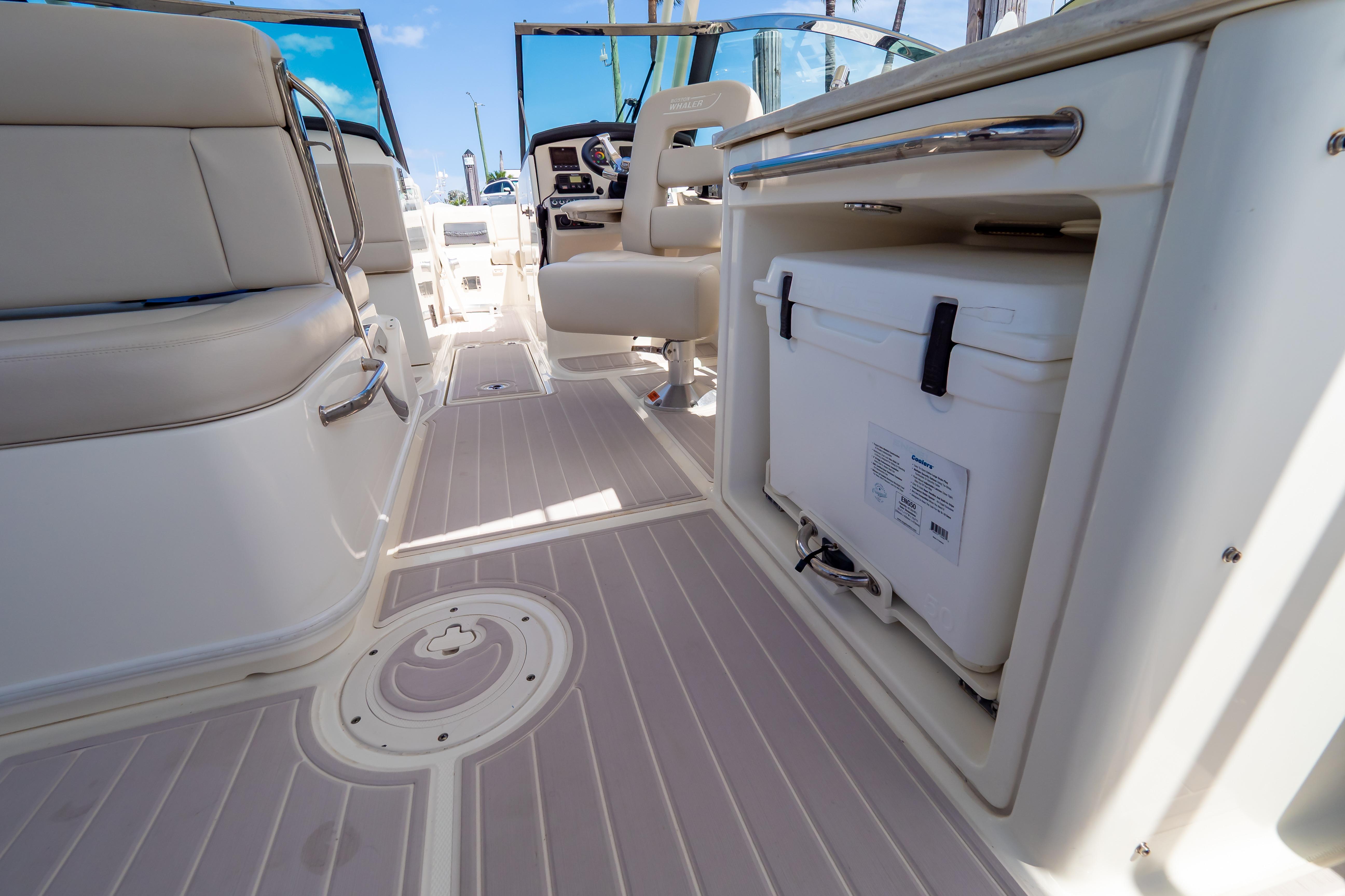 Interior view of 2019 Boston Whaler 270 Vantage boat, featuring seating and storage.