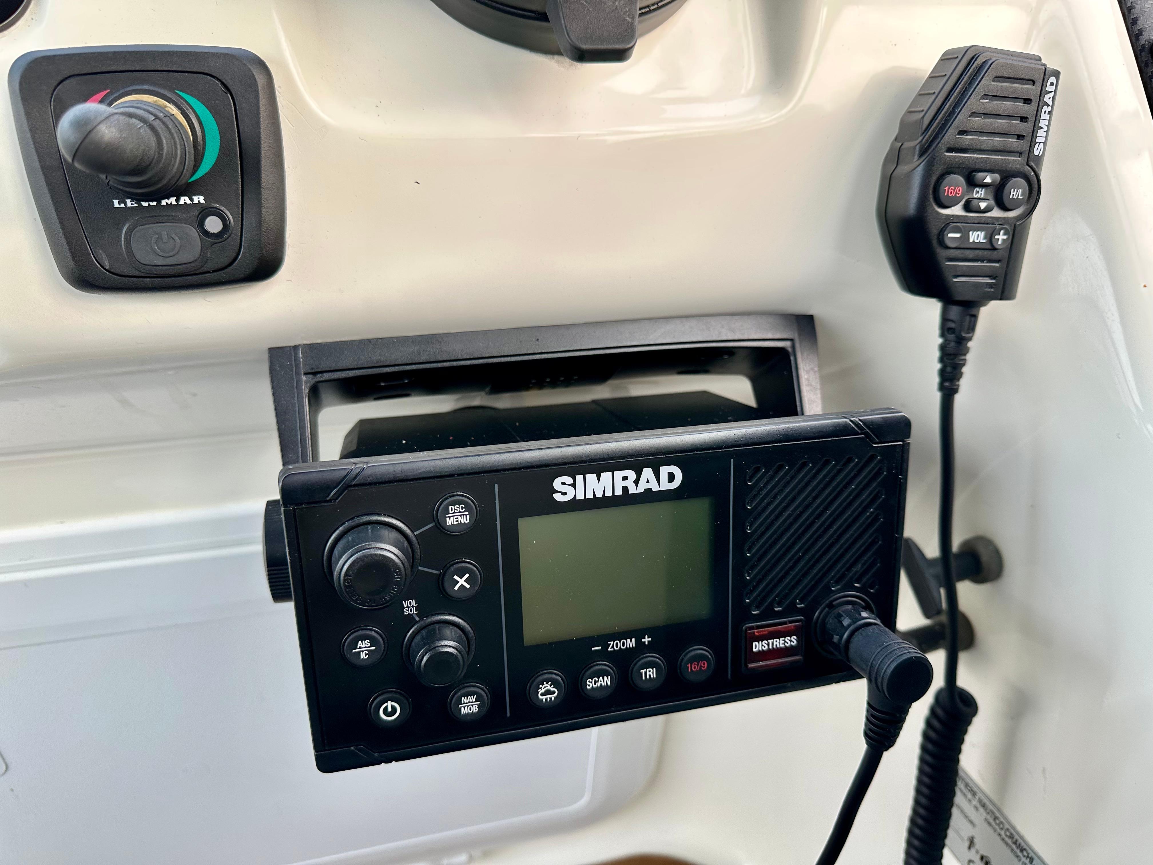 Simrad marine radio and controls on 1999 Cranchi Endurance 39 boat dashboard.
