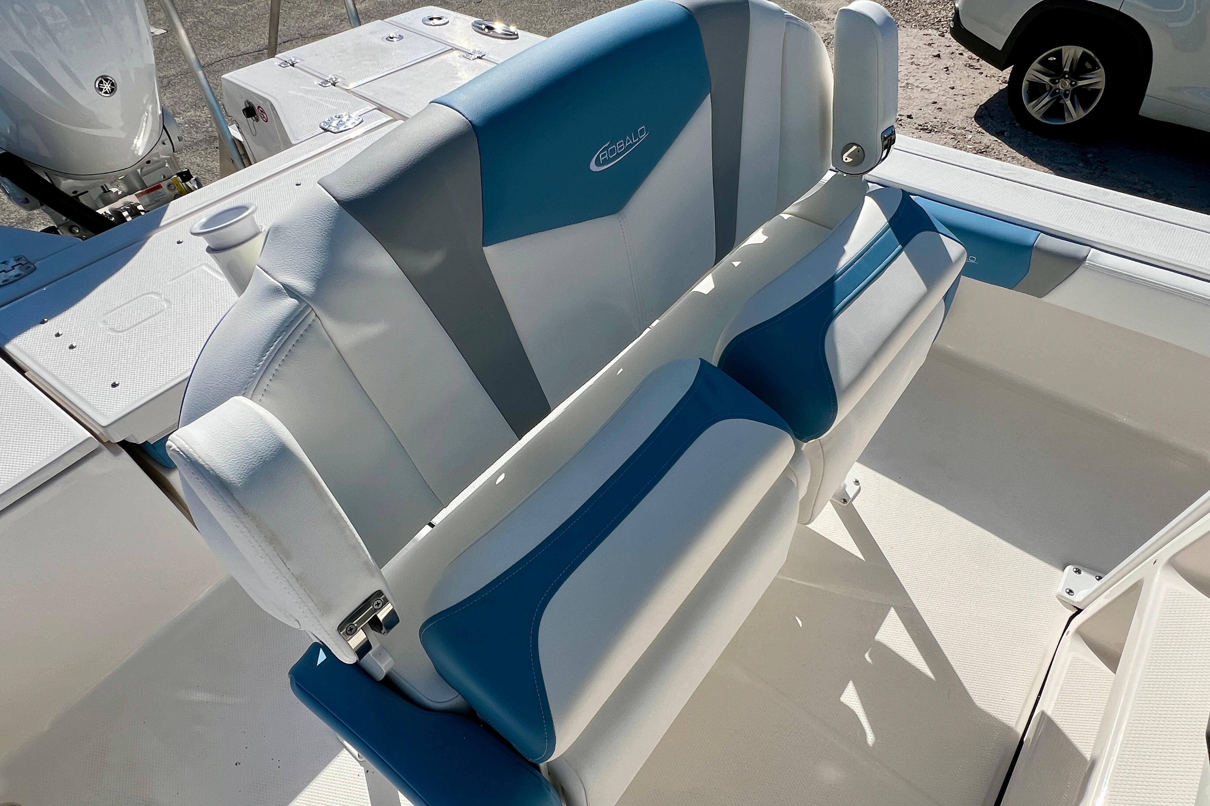 2026 Robalo 246 Cayman boat interior with blue and white seating.