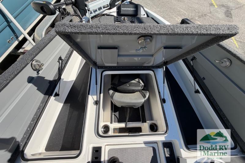2021 Caymas CX 18 SS boat storage compartment open, showcasing interior seating and equipment.