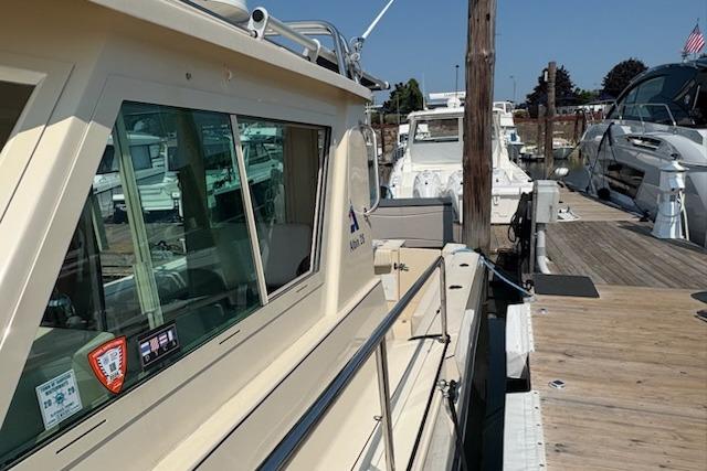2003 Albin 28 Tournament Express docked at a marina, showcasing its side view and cabin.
