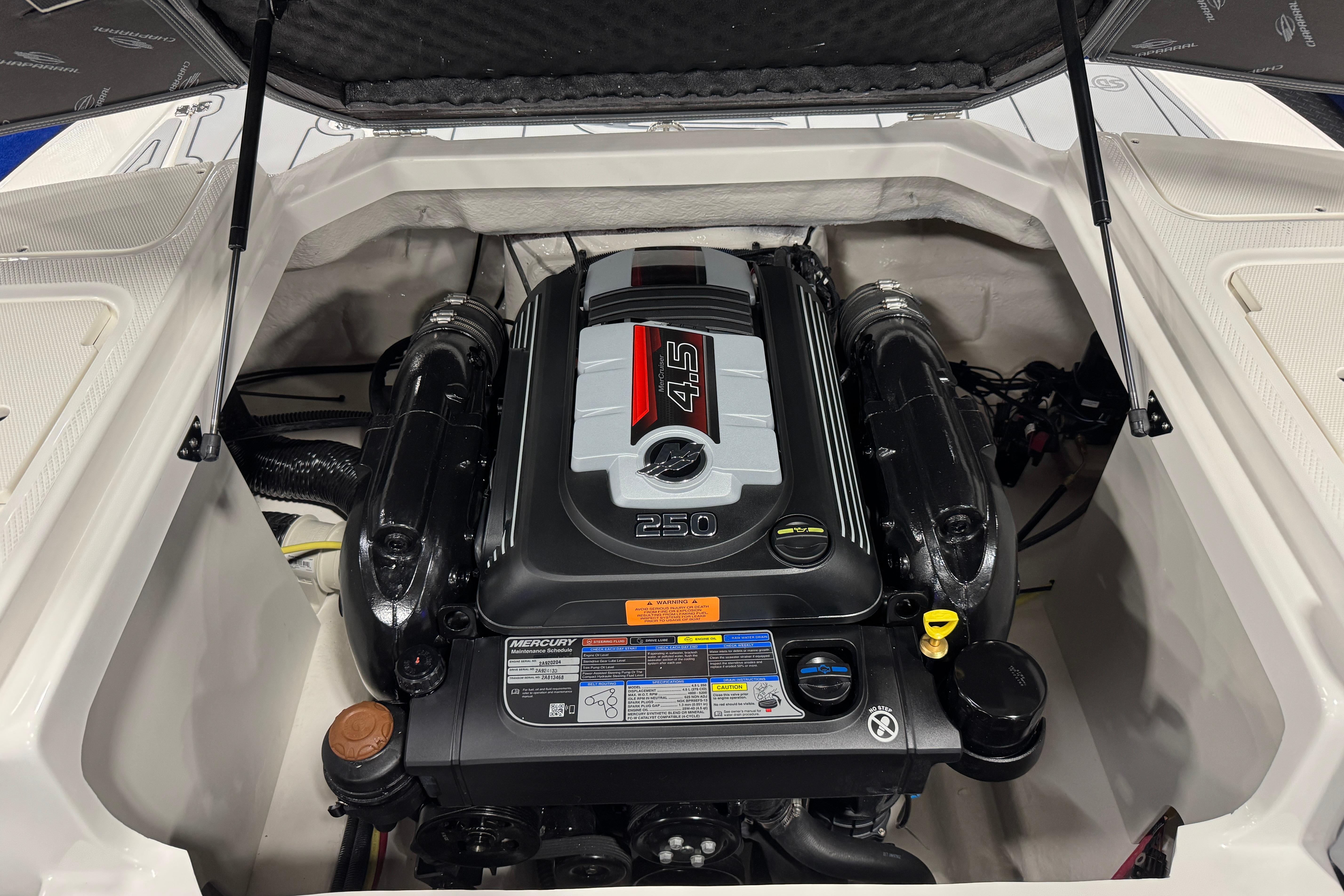 2026 Chaparral 23 SSi boat engine compartment with Mercury 4.5L 250 HP engine.