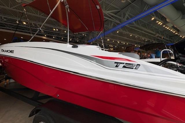 2026 Tahoe T21 boat with red and white design displayed indoors.