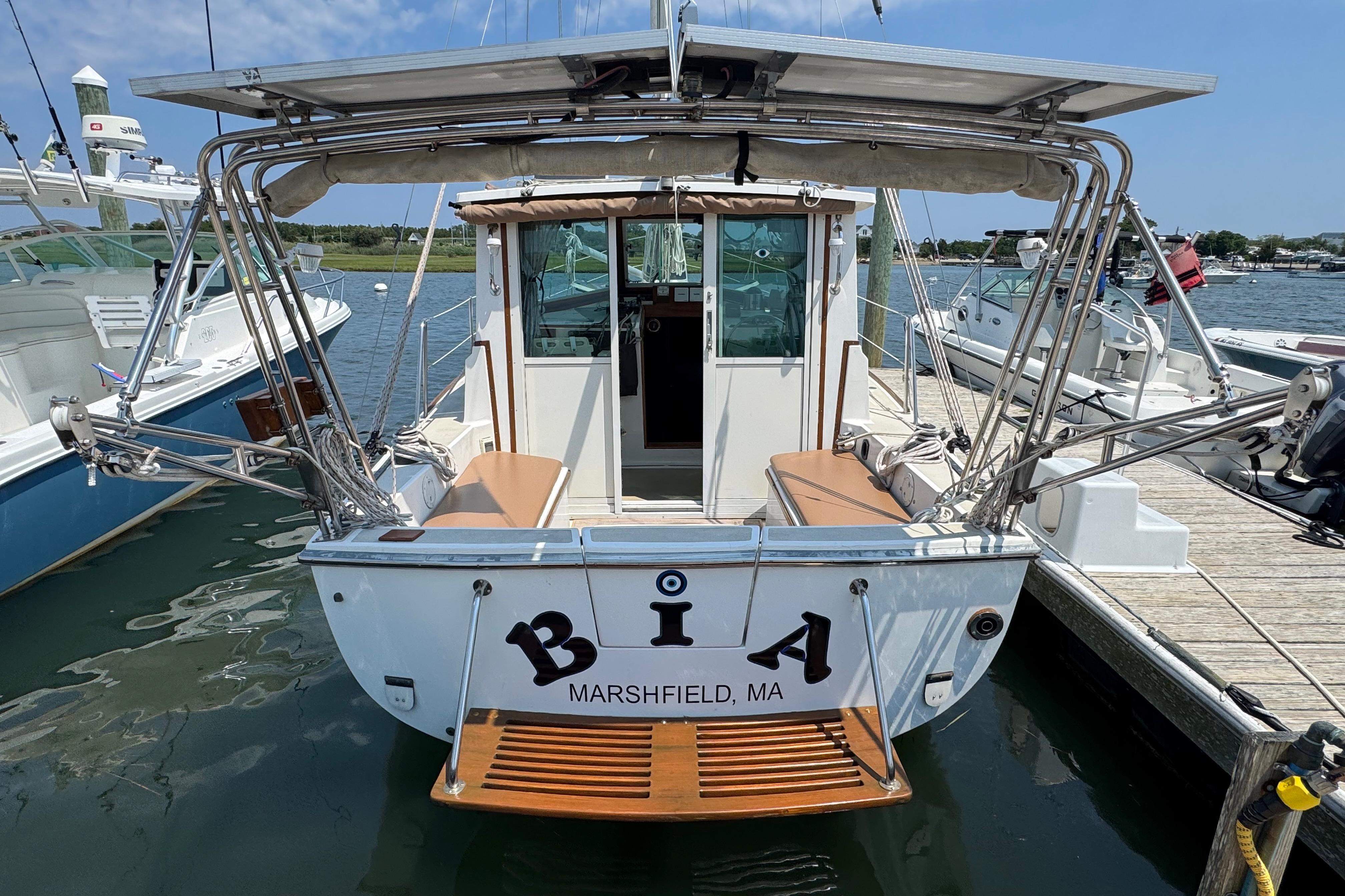 Cape Dory 30 Motorsailer, 1989 model, docked in Marshfield, MA, rear view.