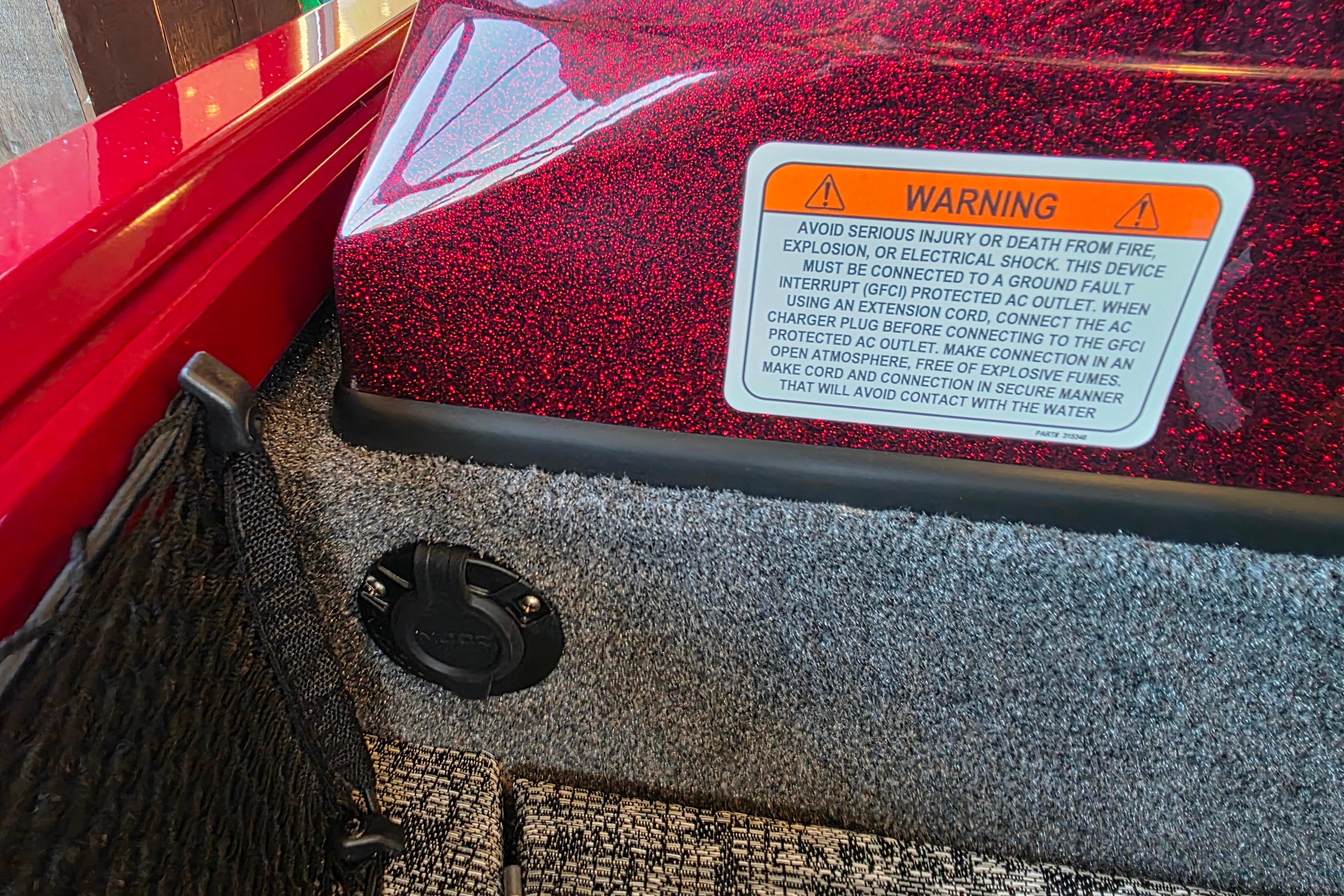 Warning label on 2026 Ranger VS1782SC Reata boat with red metallic finish.