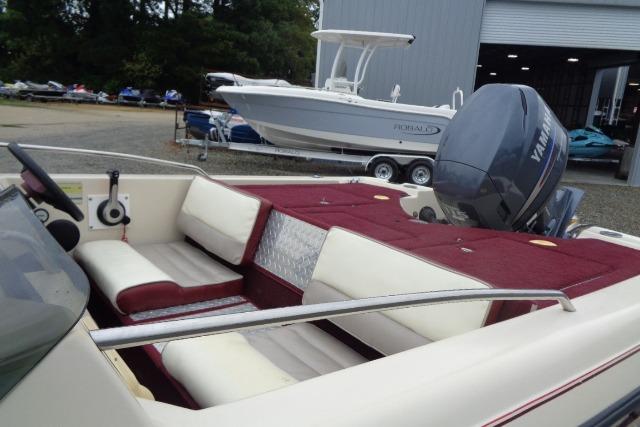 1996 Quantum 180 XD boat with Yamaha outboard, featuring maroon and white interior.