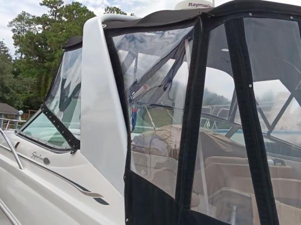 2004 Chaparral Signature 350 boat with clear enclosure and sleek design.