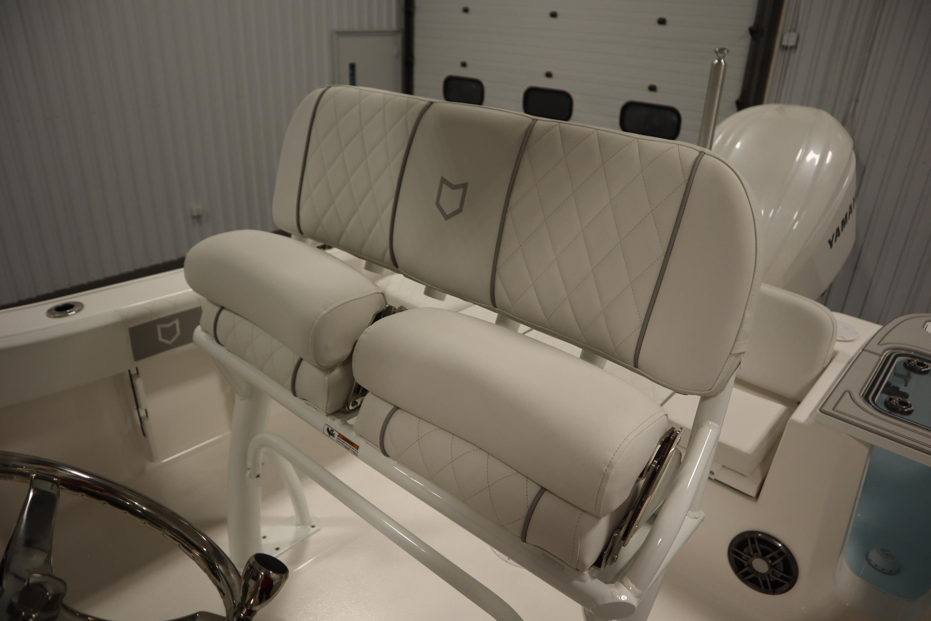 2026 Sea Fox 228 Commander boat with luxurious white seating and diamond stitching.