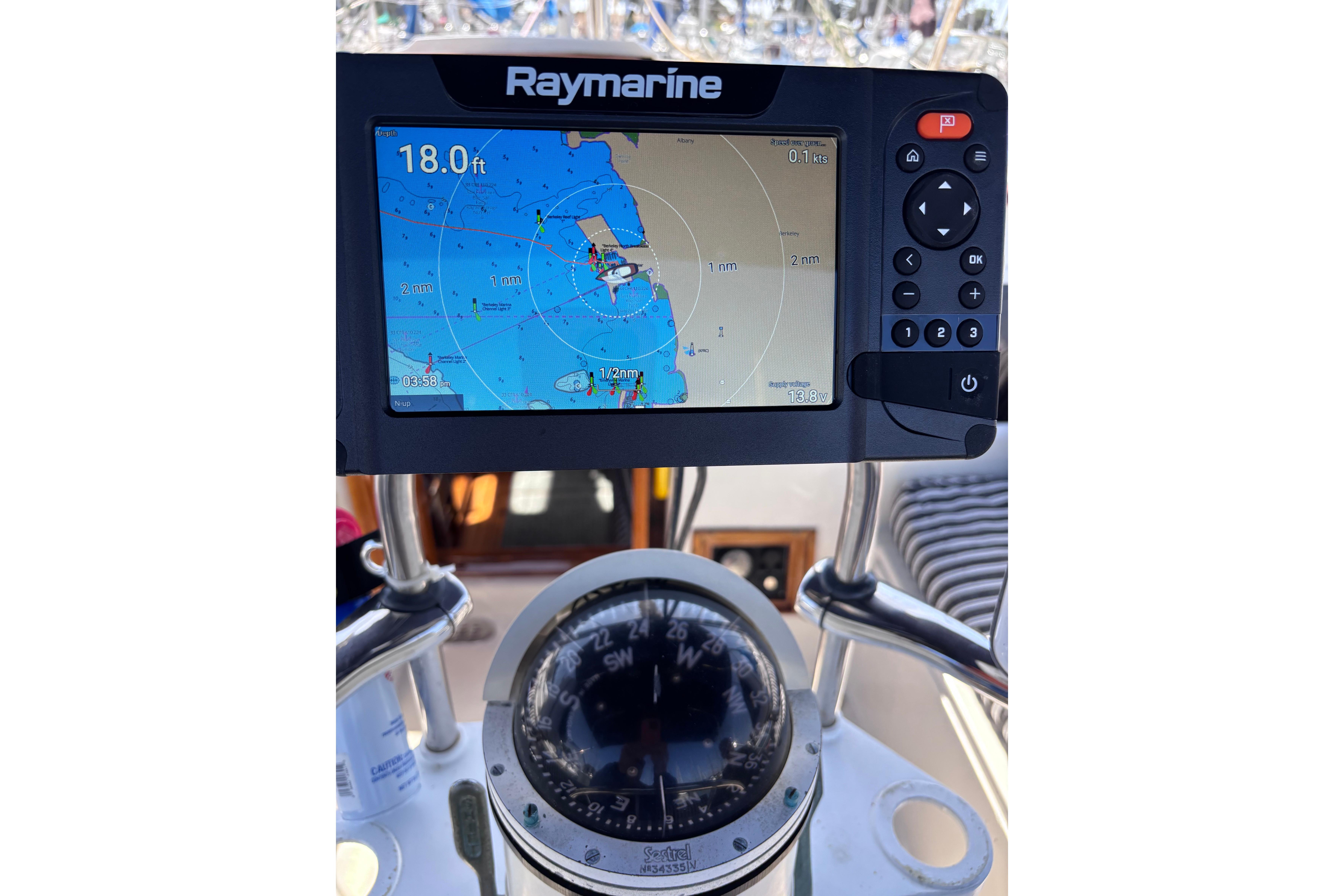 Raymarine navigation system and compass on a 1978 Swift 33 boat.