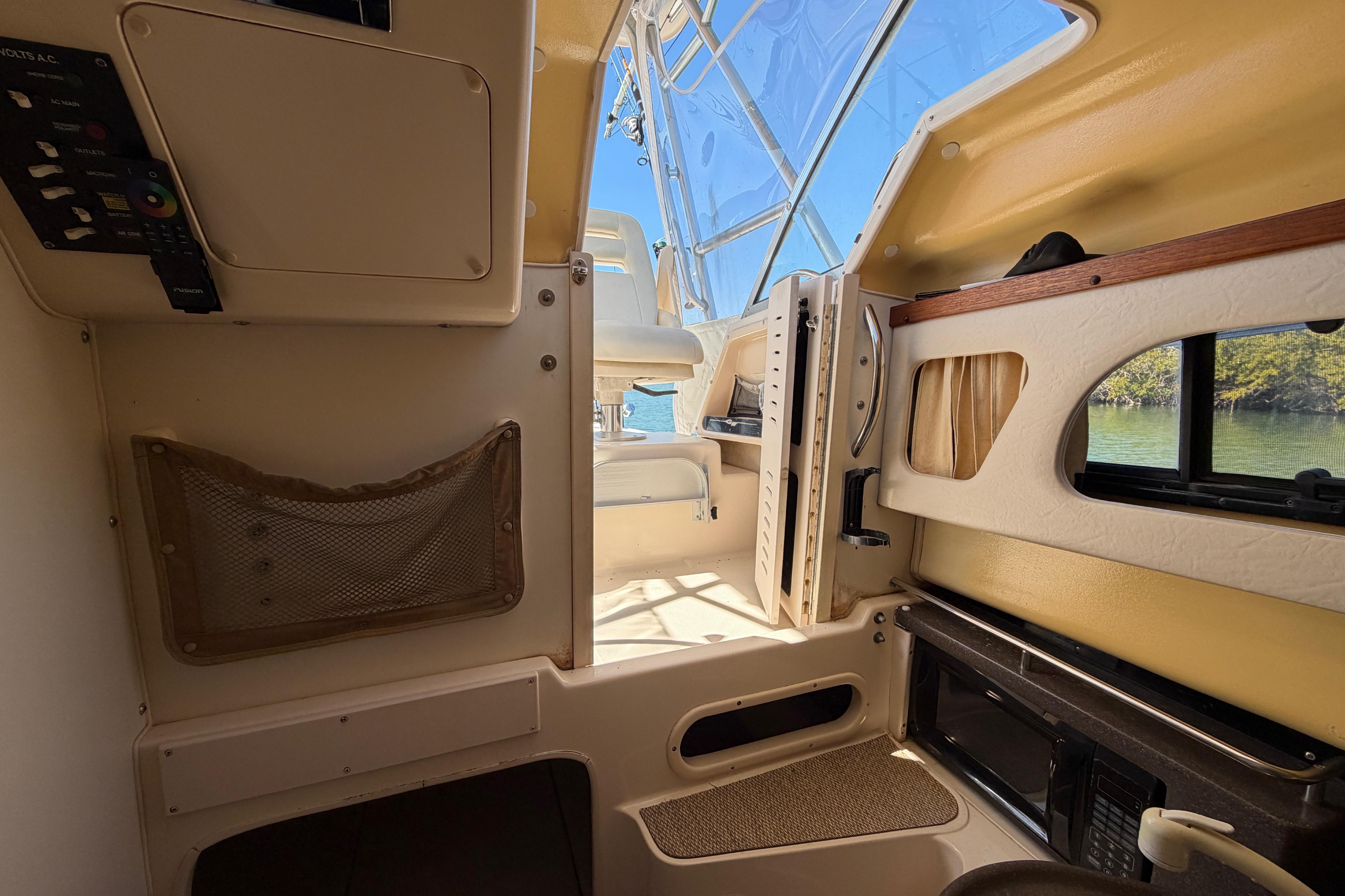 Interior of 2006 Grady-White Sailfish 282 boat, featuring cabin amenities and natural light.