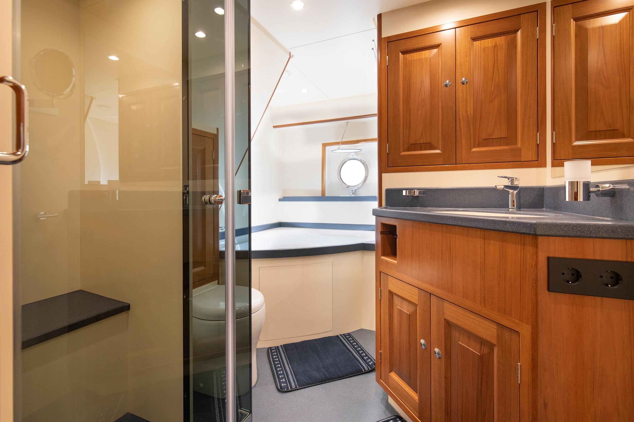 Luxurious 2022 Ridas Custom Yacht bathroom with wooden cabinetry and modern fixtures.