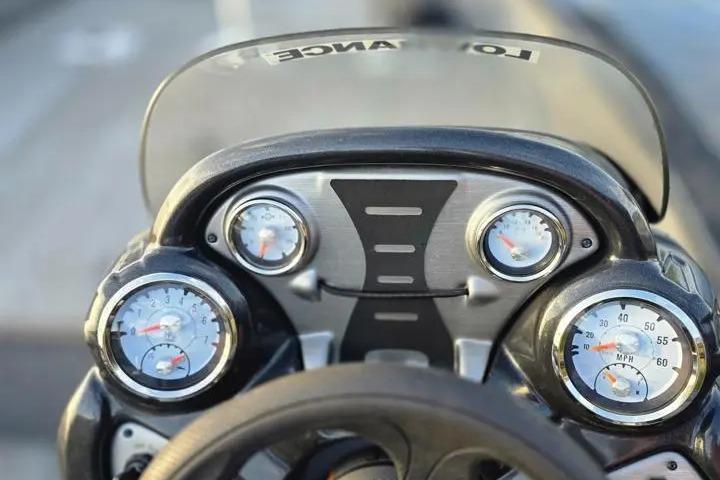 Dashboard of 2020 Tracker Pro Team 175 TF boat with gauges and steering wheel.