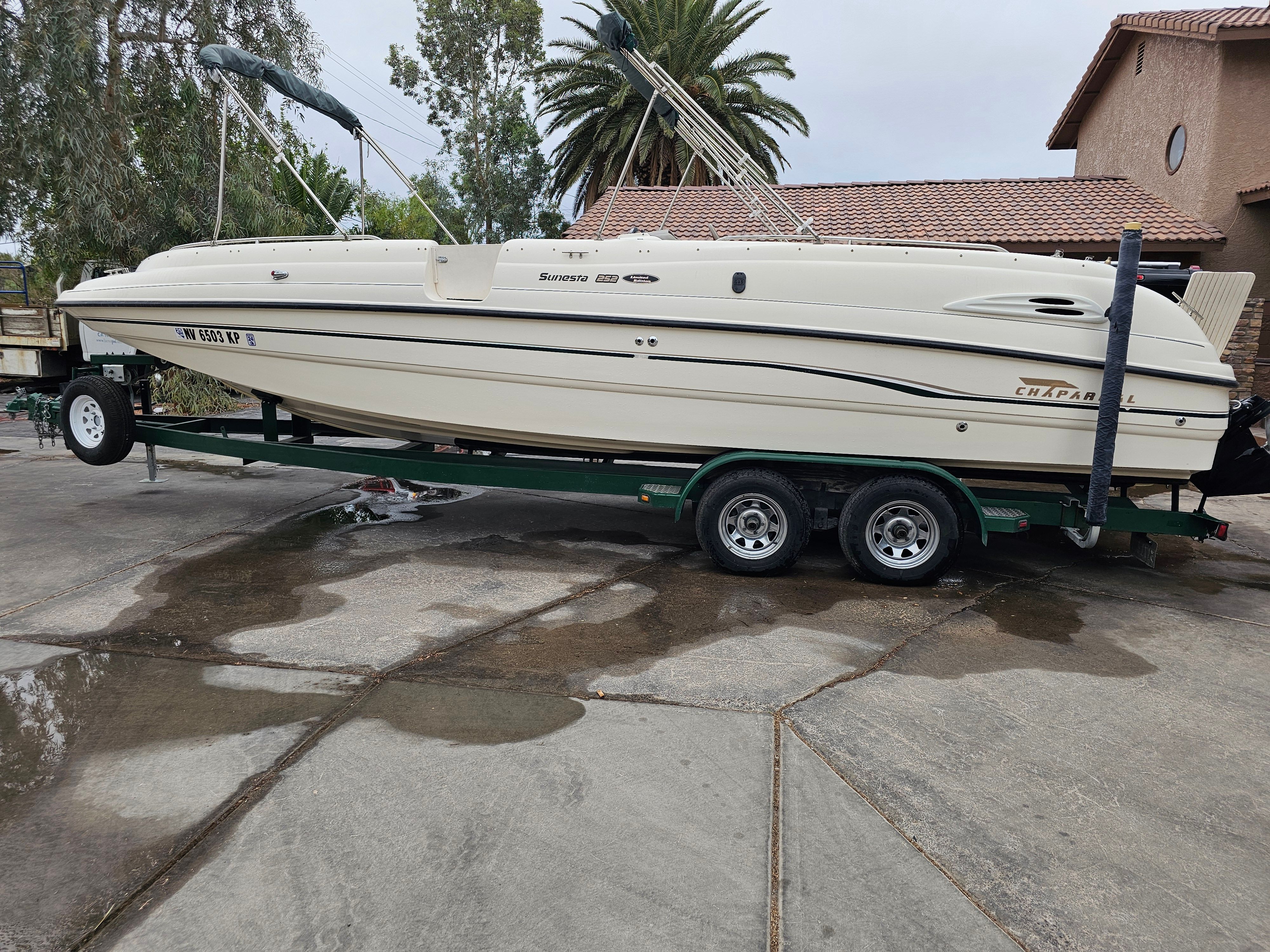 1998 Chaparral Sunesta 252 Special Edition on trailer, side view.