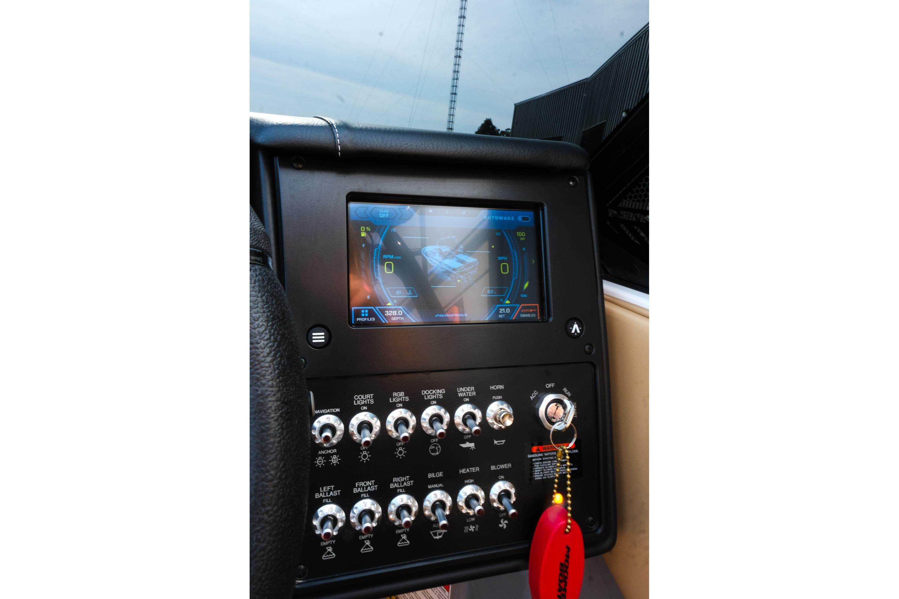 2023 Moomba Mondo dashboard with touchscreen display and control switches.