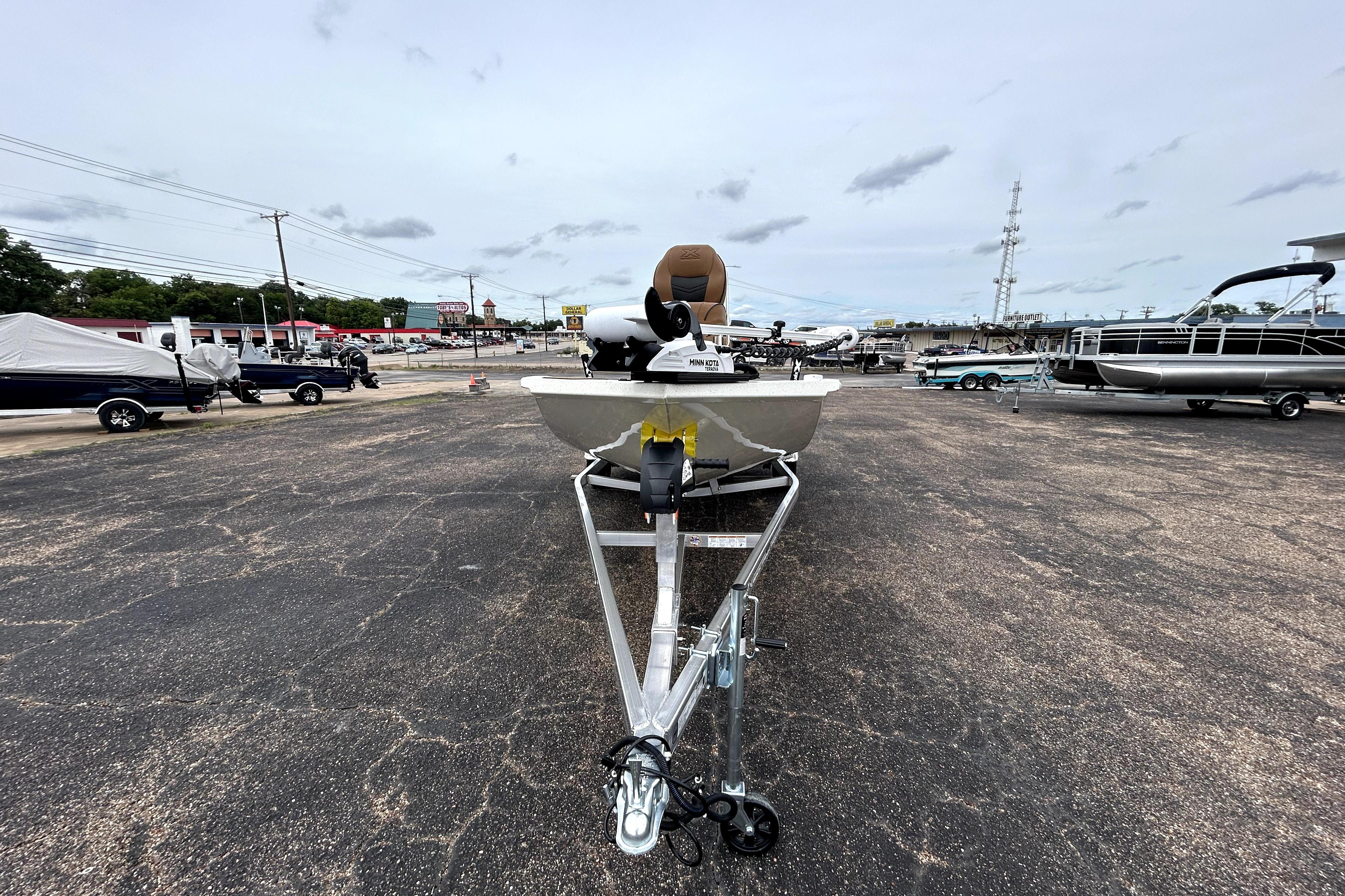 2026 Xpress H20B Bay boat on trailer in outdoor dealership lot.
