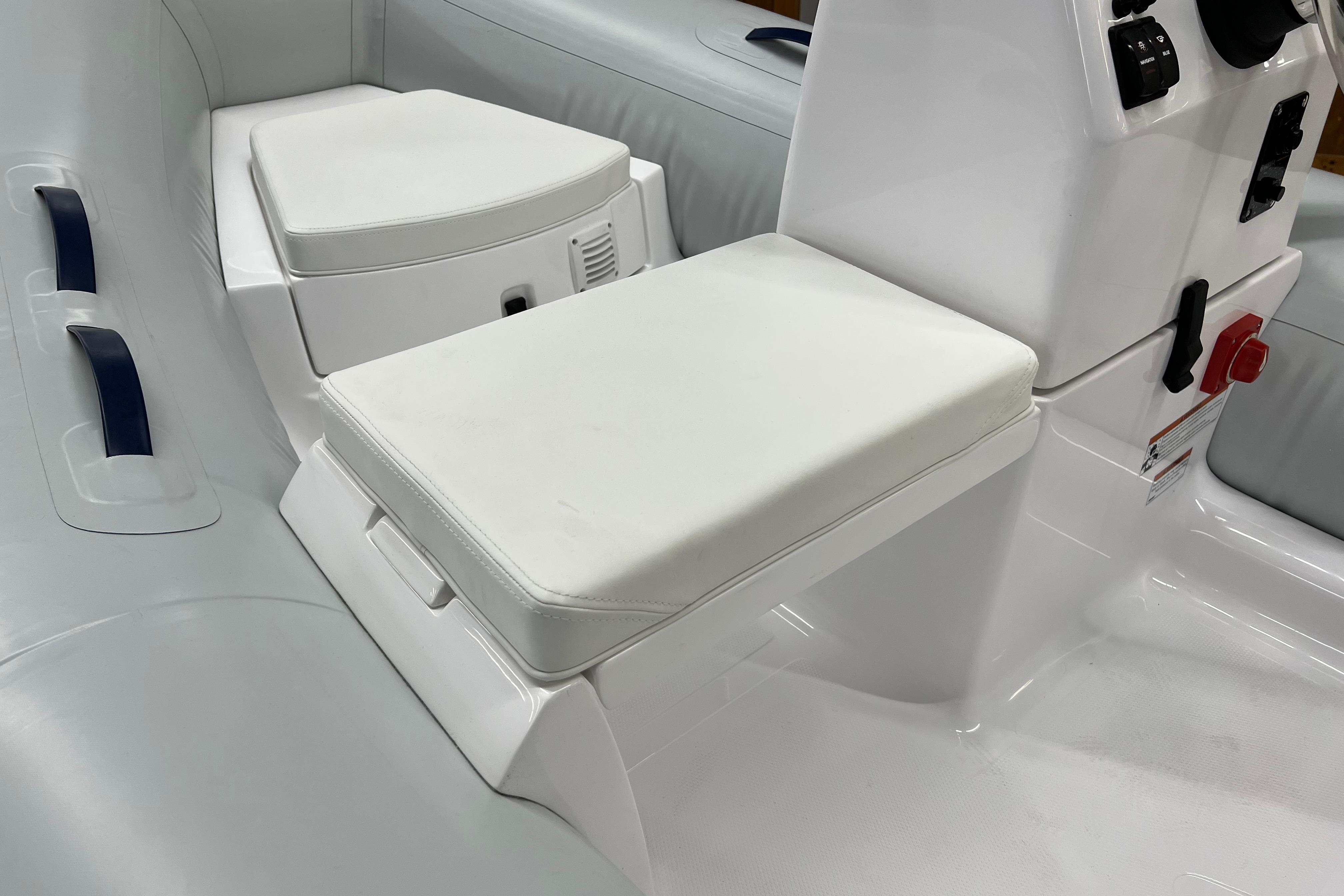 2023 AB Inflatables Mares 11 VSX boat interior with white seating and control panel.